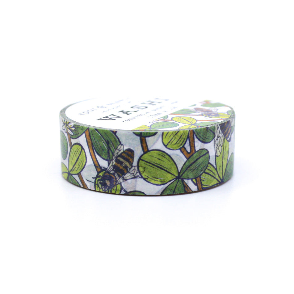 This White Clover Bee washi tape, featuring intricate illustrations of bees buzzing around delicate white clover flowers, this charming washi tape is perfect for adding a touch of whimsy and elegance to your planners, journals, or scrapbooks.