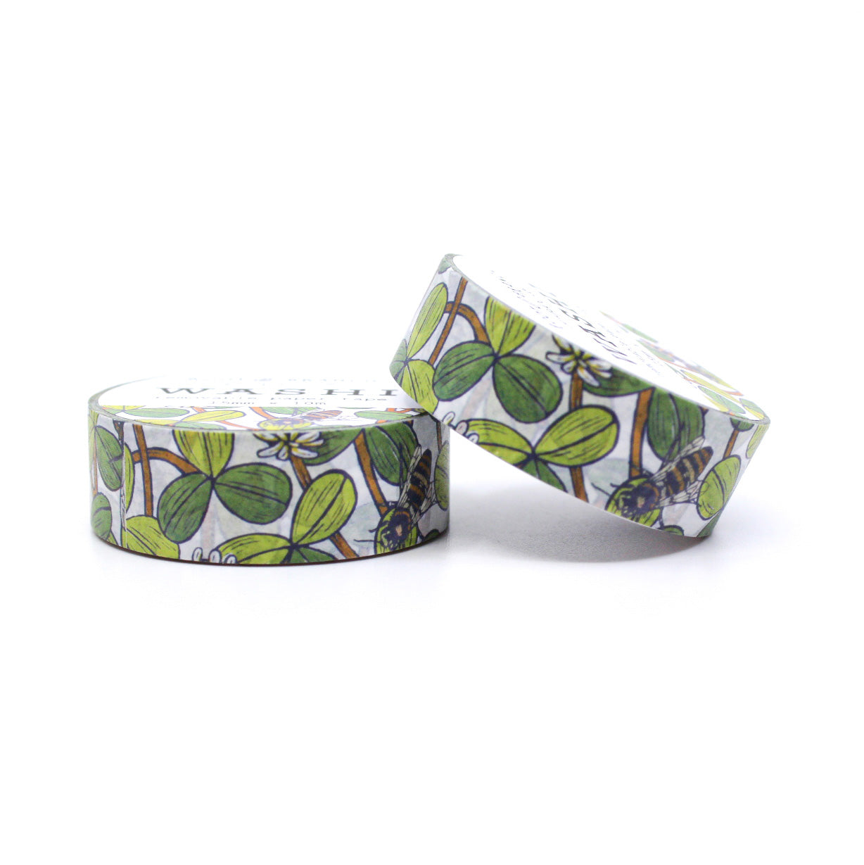 This White Clover Bee washi tape, featuring intricate illustrations of bees buzzing around delicate white clover flowers, this charming washi tape is perfect for adding a touch of whimsy and elegance to your planners, journals, or scrapbooks.