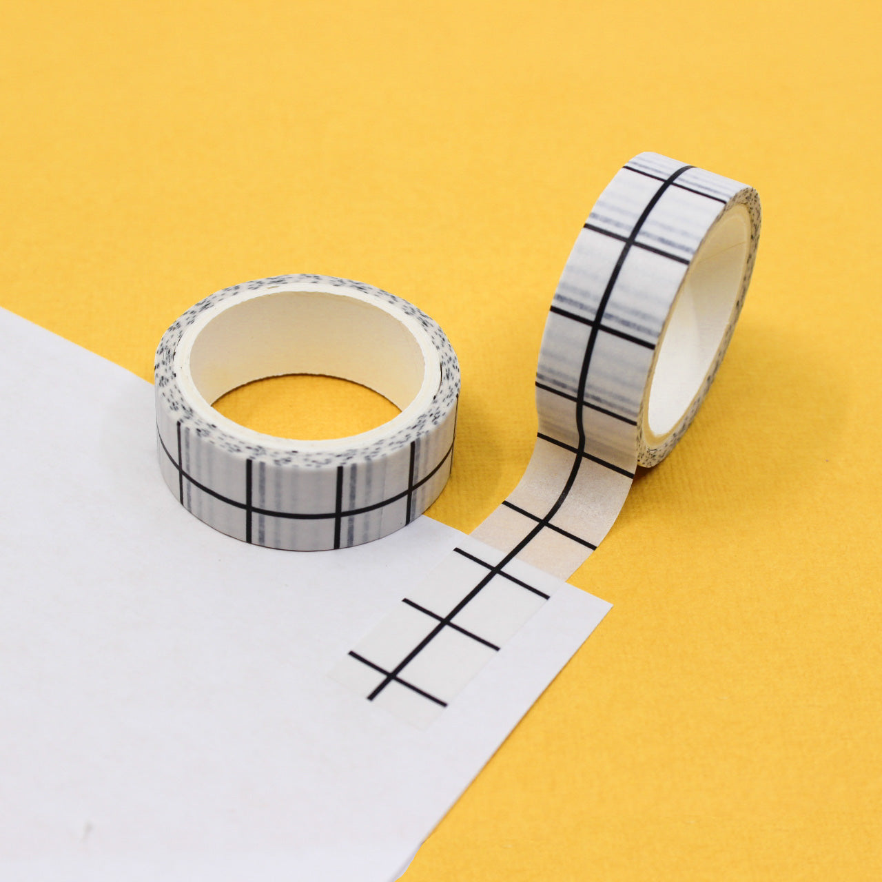 This versatile washi tape features a large white grid plaid design, adding a modern and clean look to your projects. Ideal for bullet journaling, scrapbooking, and various crafts, this tape offers endless creative possibilities. This tape is sold at BBB Supplies Craft Shop.