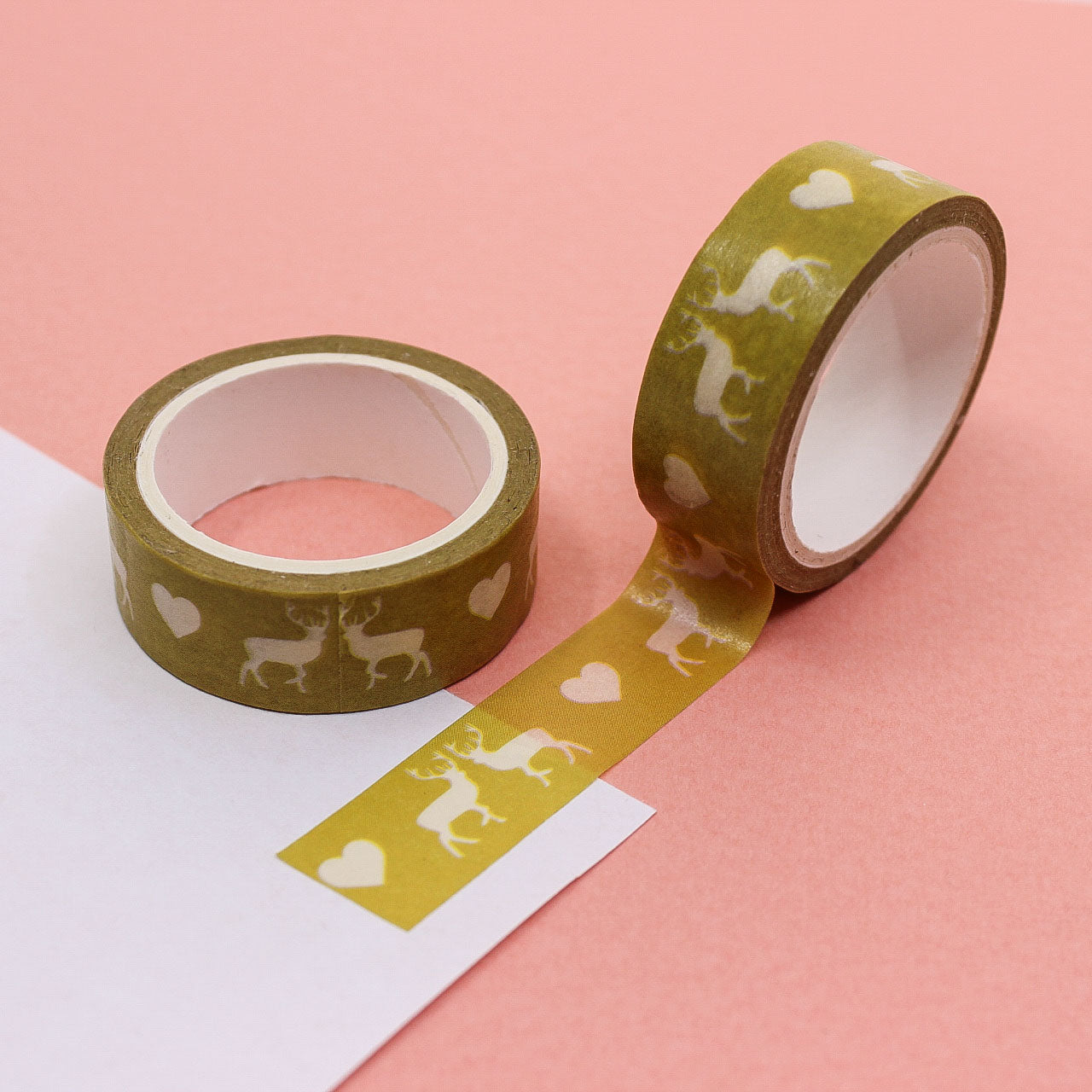 Yellow washi tape featuring cute deer and heart illustrations on a bright yellow background, ideal for scrapbooking and crafting.