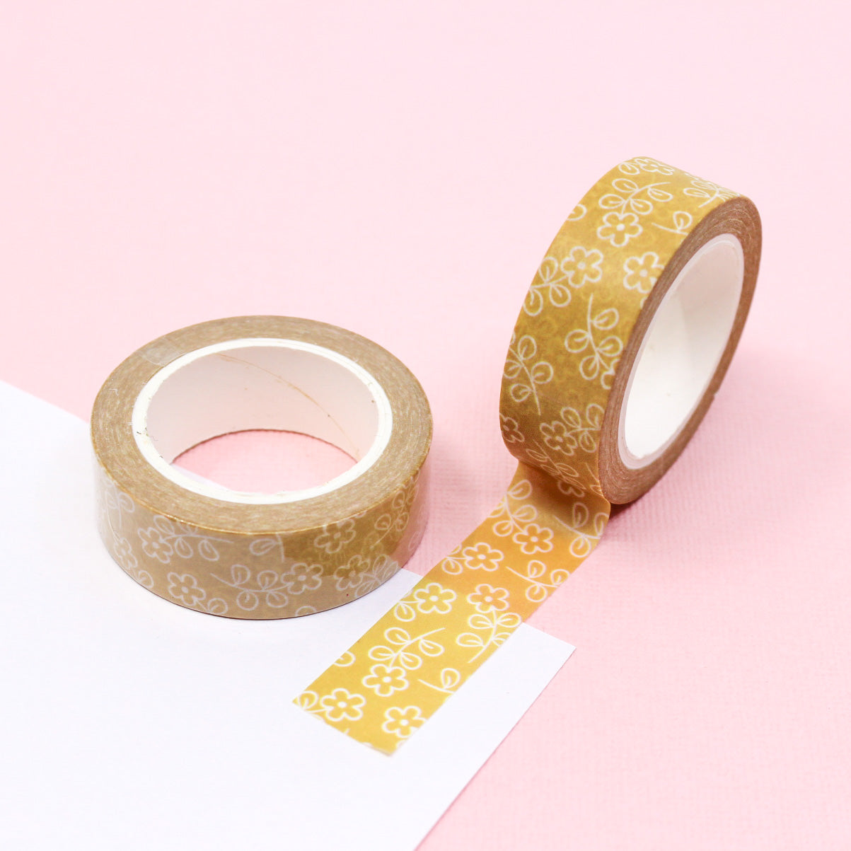 This vibrant washi tape features a pattern of yellow daisy flowers, perfect for adding a cheerful touch to your crafts and projects. This tape is sold at BBB Supplies Craft Shop.