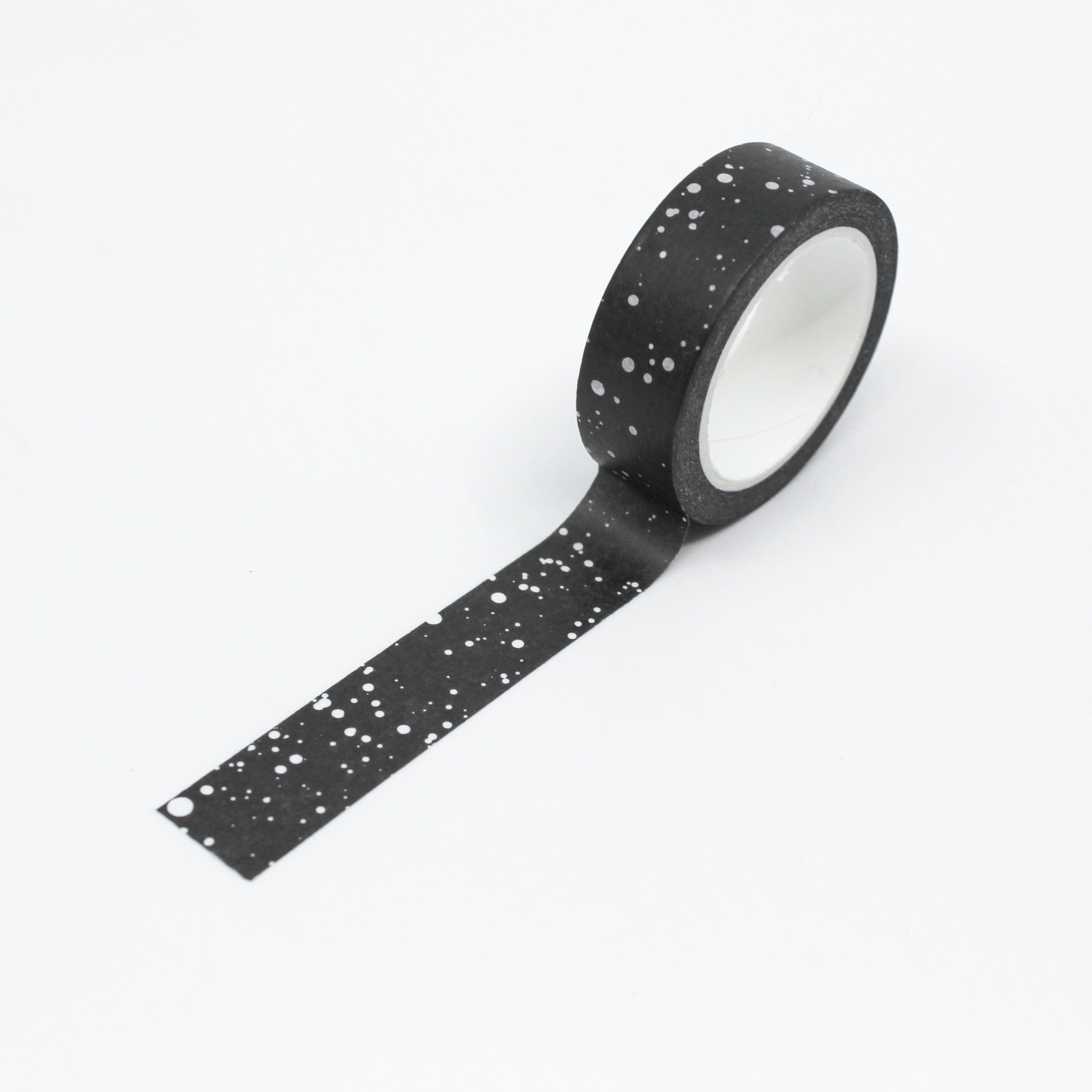 This photo is of a modern black and white paint Random dotted washi tape from worthwhile paper and sold at BBB Supplies craft and journaling shop.