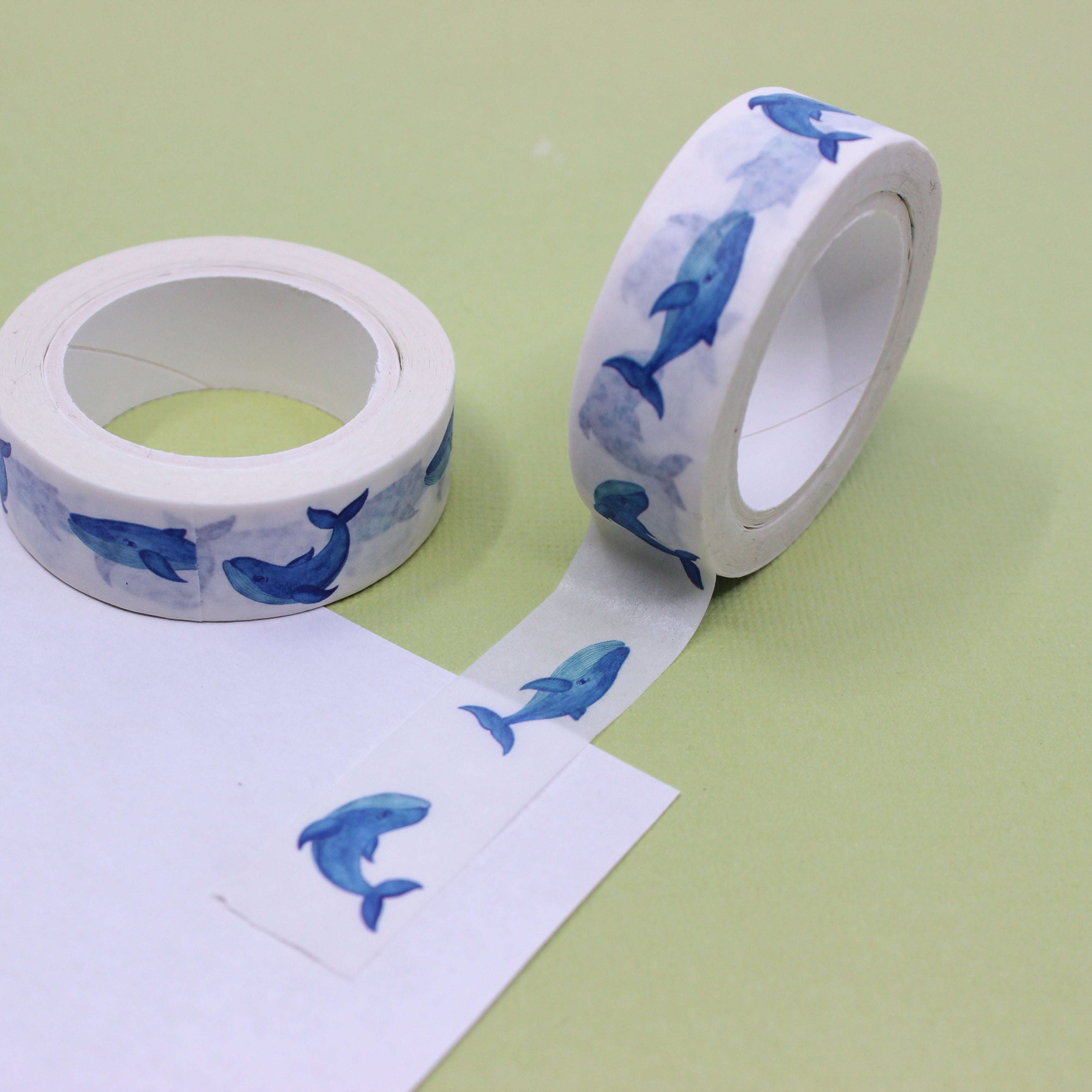 This is a blue swimming whales pattern washi tape from BBB Supplies Craft Shop