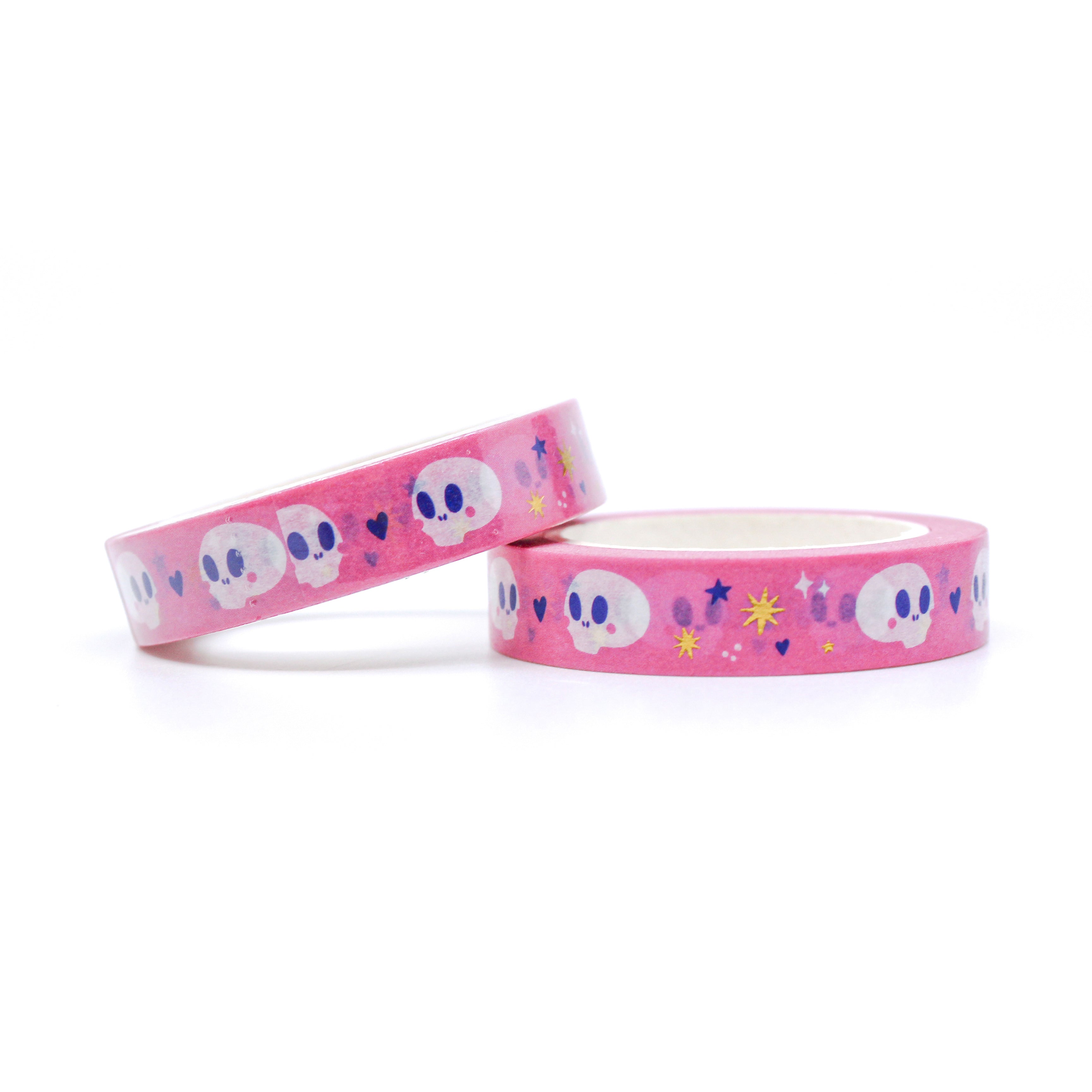 This is a roll of playful halloween themed skulls with purple hearts and gold foil stars on a pink background washi tapes from BBB Supplies Craft Shop
