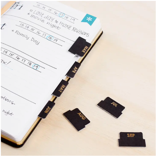 These black and gold neutral self-adhesive monthly tabs are perfect for your budget journal, bullet journal or planner if you want to set up your own monthly spread. They are designed by Erin Condren and sold at BBB Supplies Craft Shop.