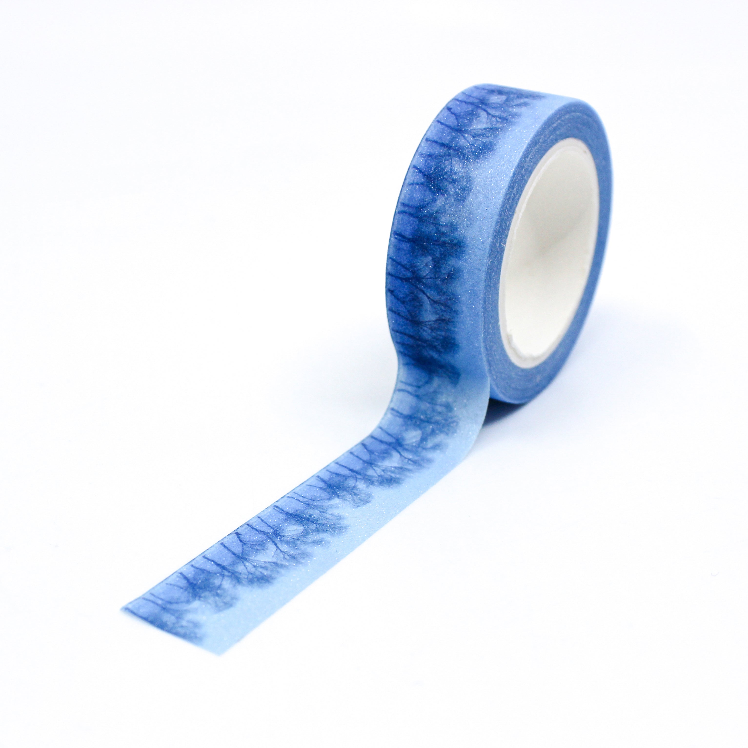 This is a beautiful and moody blue glitter winter tree forest landscape washi tape from BBB Supplies.