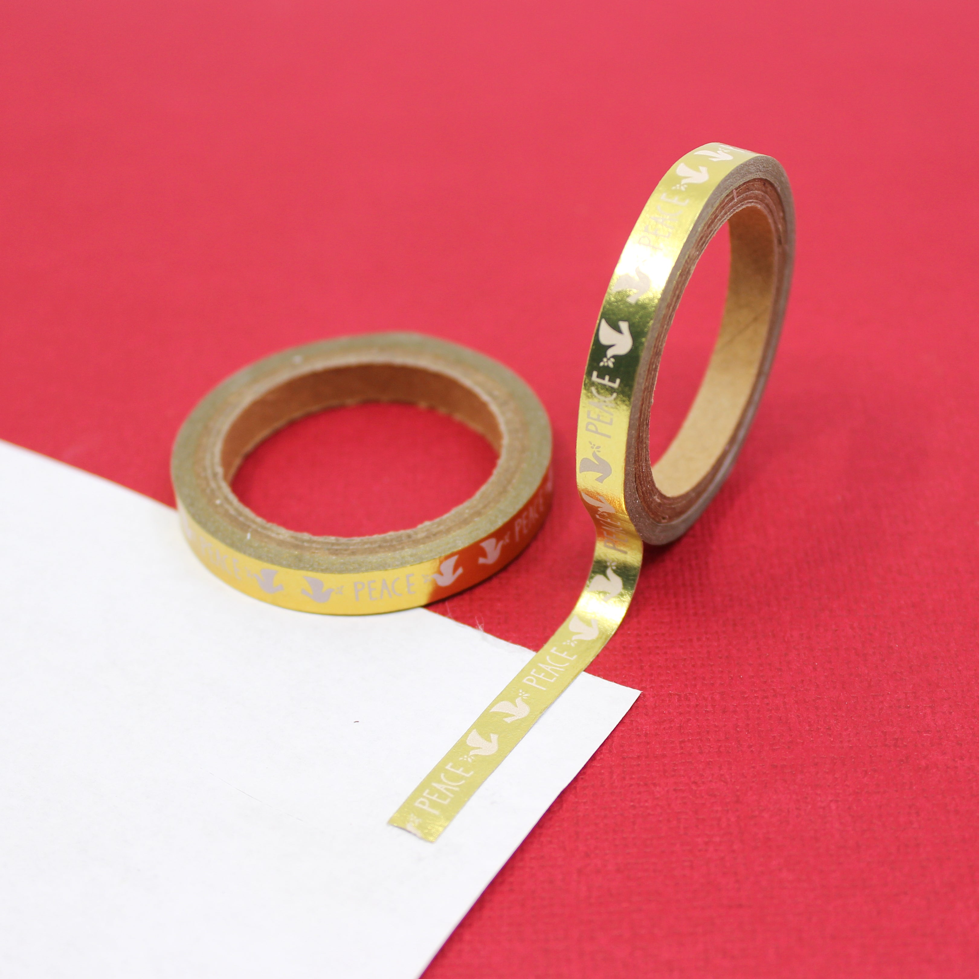 This beautiful gold foil tape is perfect for your holiday craft projects and spread. This tape features doves and peace text. This tape is sold at BBB Supplies Craft Shop.