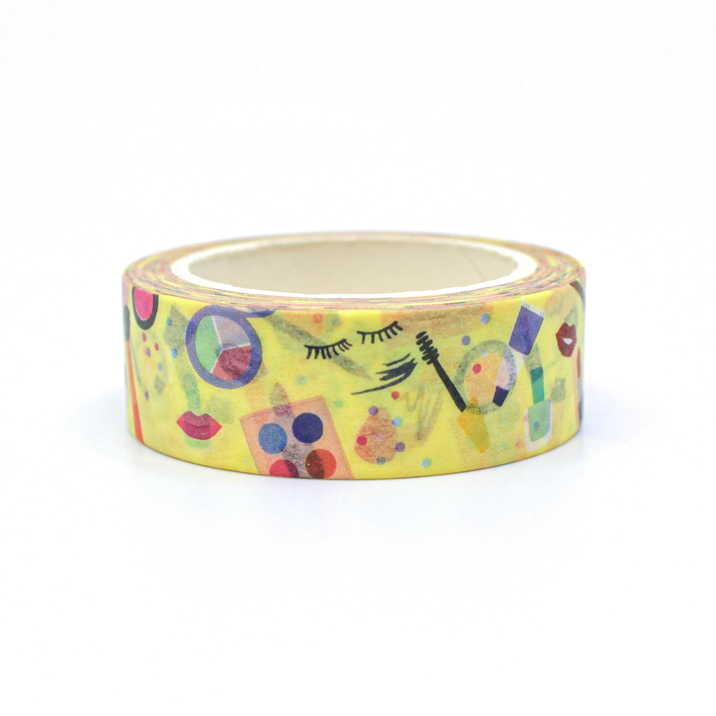 This is a collection of ladies makeup items and beauty products on yellow foil pattern washi tape from BBB Supplies Craft Shop