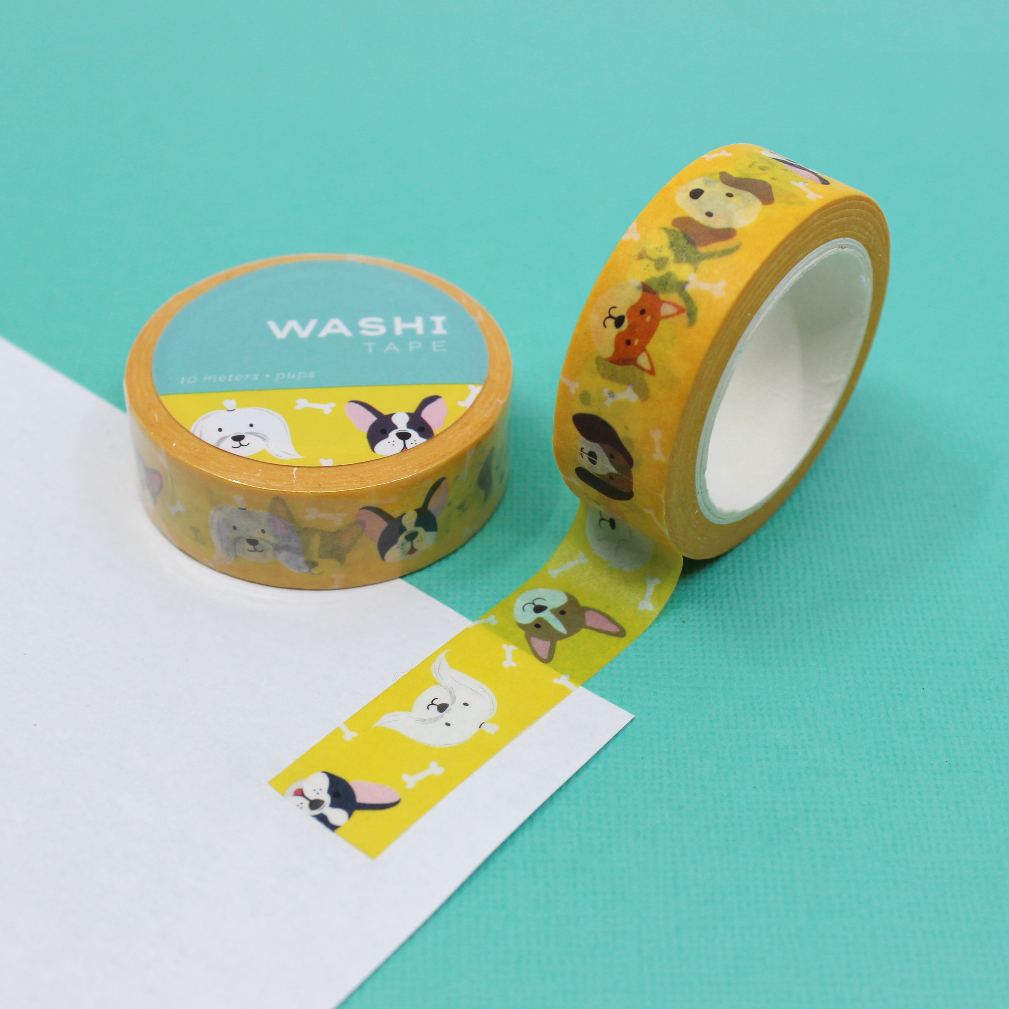 This is a yellow foil cute pup and dog faces pattern washi tape from BBB Supplies Craft Shop