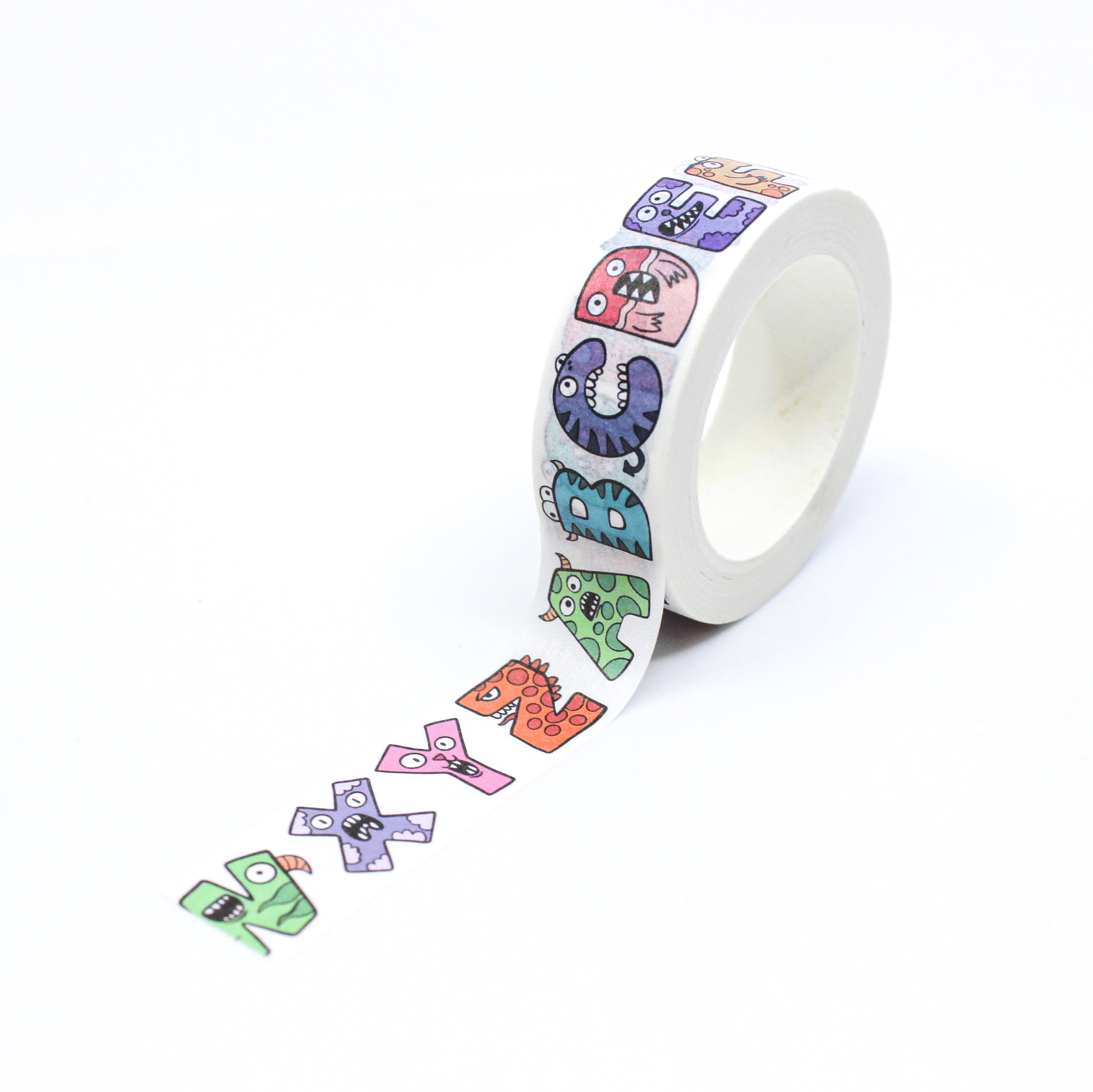 This is a full pattern repeat view of monster alphabet letters washi tape from BBB Supplies Craft Shop