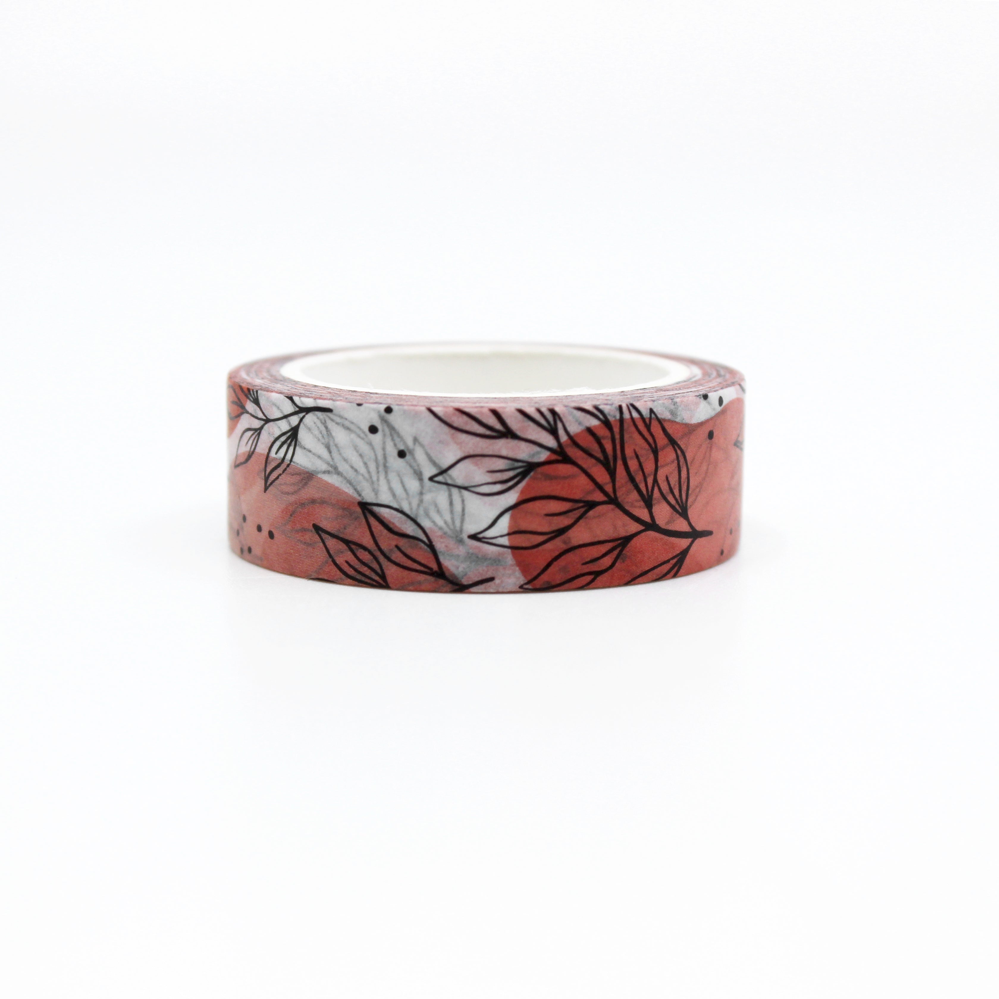 This is a colorful and vibrant pink and orange color background with black leaves washi tape from BBB Supplies Craft Shop