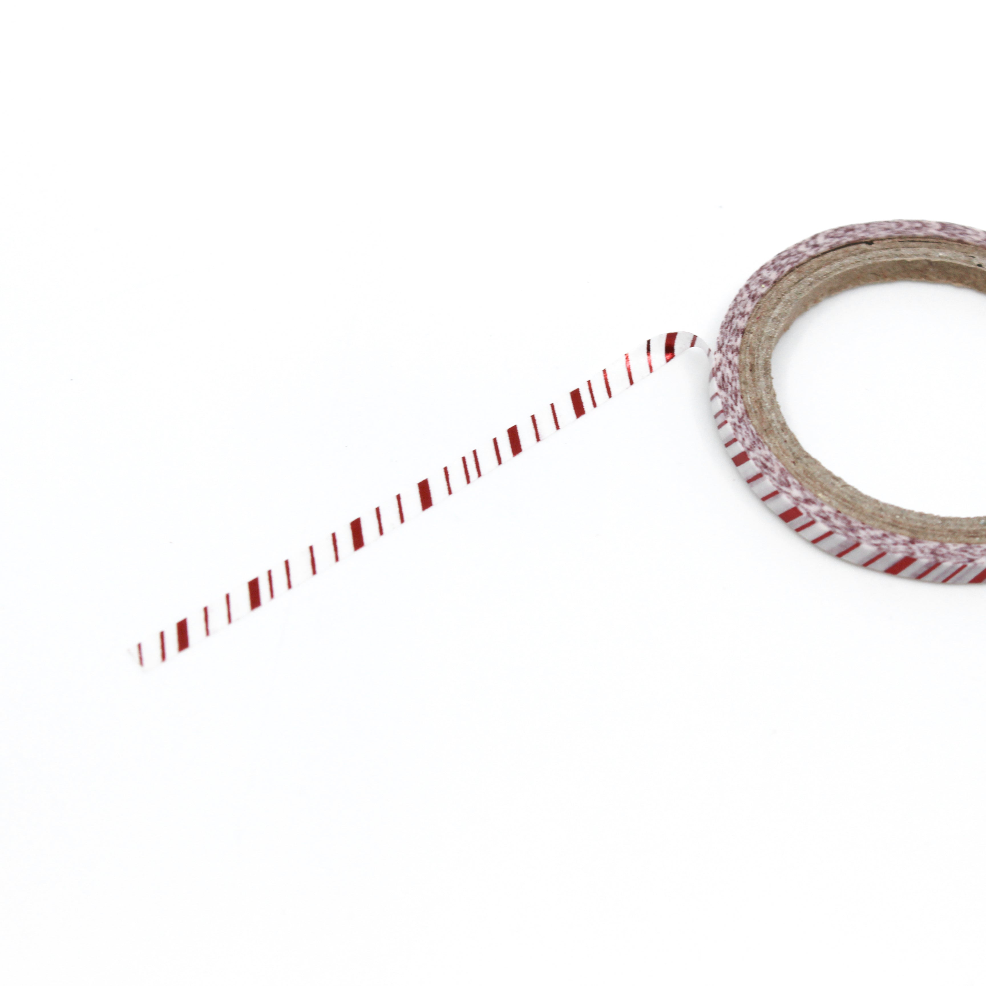 This is a full pattern repeat view of thin red foil with white stripe Christmas themed washi tape from BBB Supplies Craft Shop