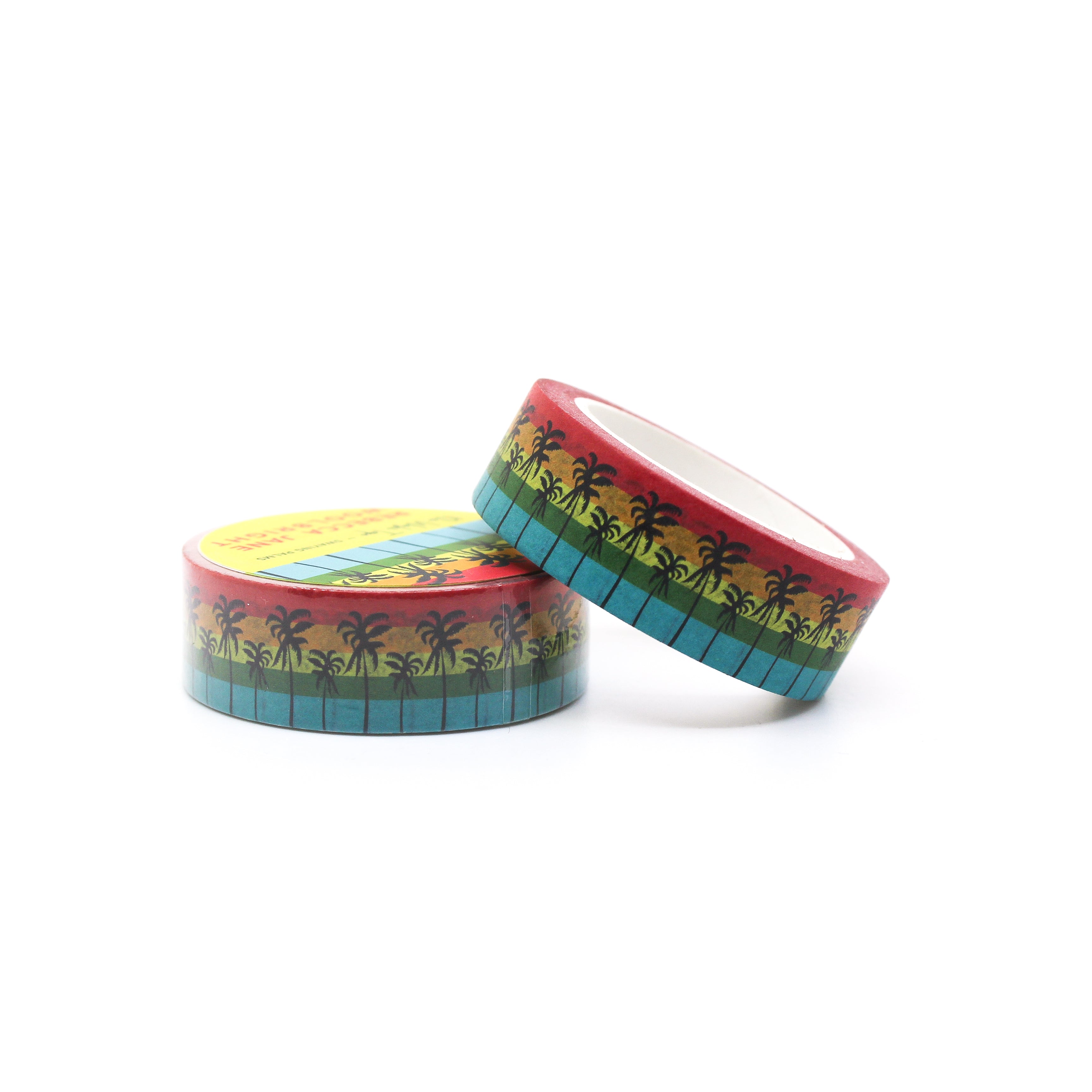 This is a roll of green palm trees with a rainbow stripe behind it washi tapes from BBB Supplies Craft Shop