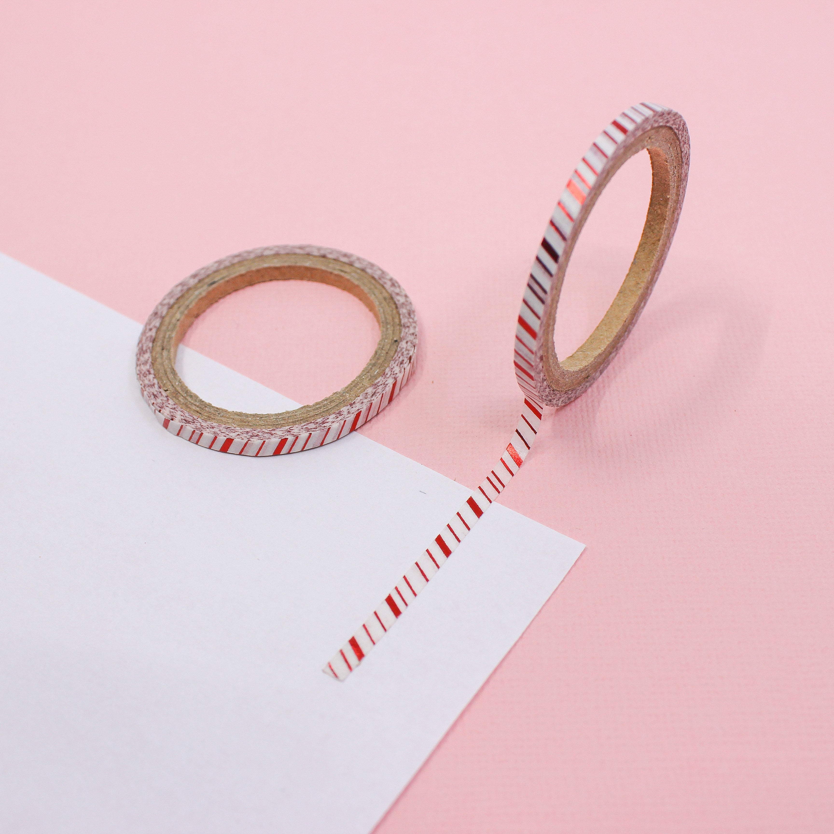 This is a thin red foil with tiny white stripe themed washi tape from BBB Supplies Craft Shop