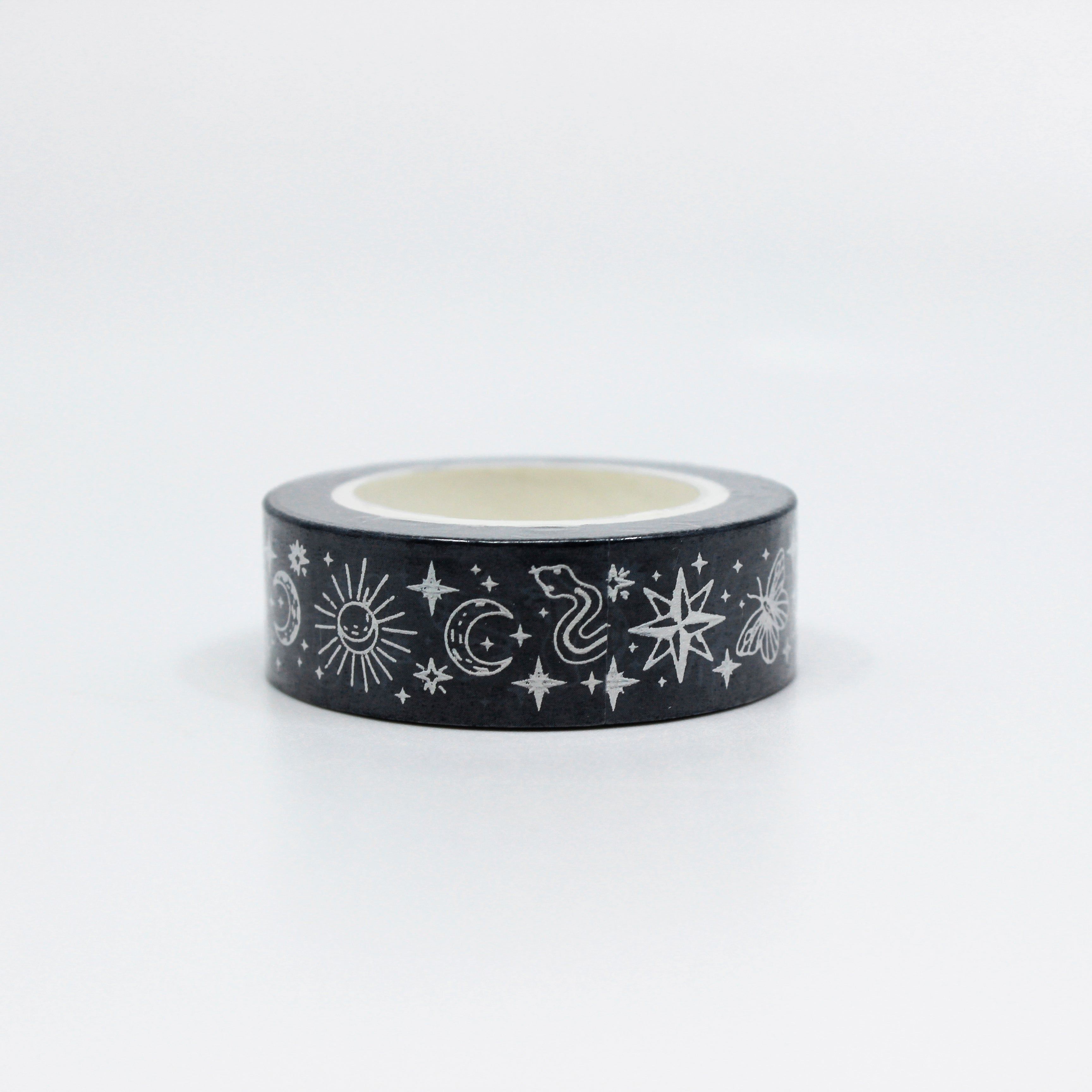 This is the side view of BBB Supplies mystics washi tape which includes snake, sun, moon, stars, and fortune teller symbols in the pattern repeat.