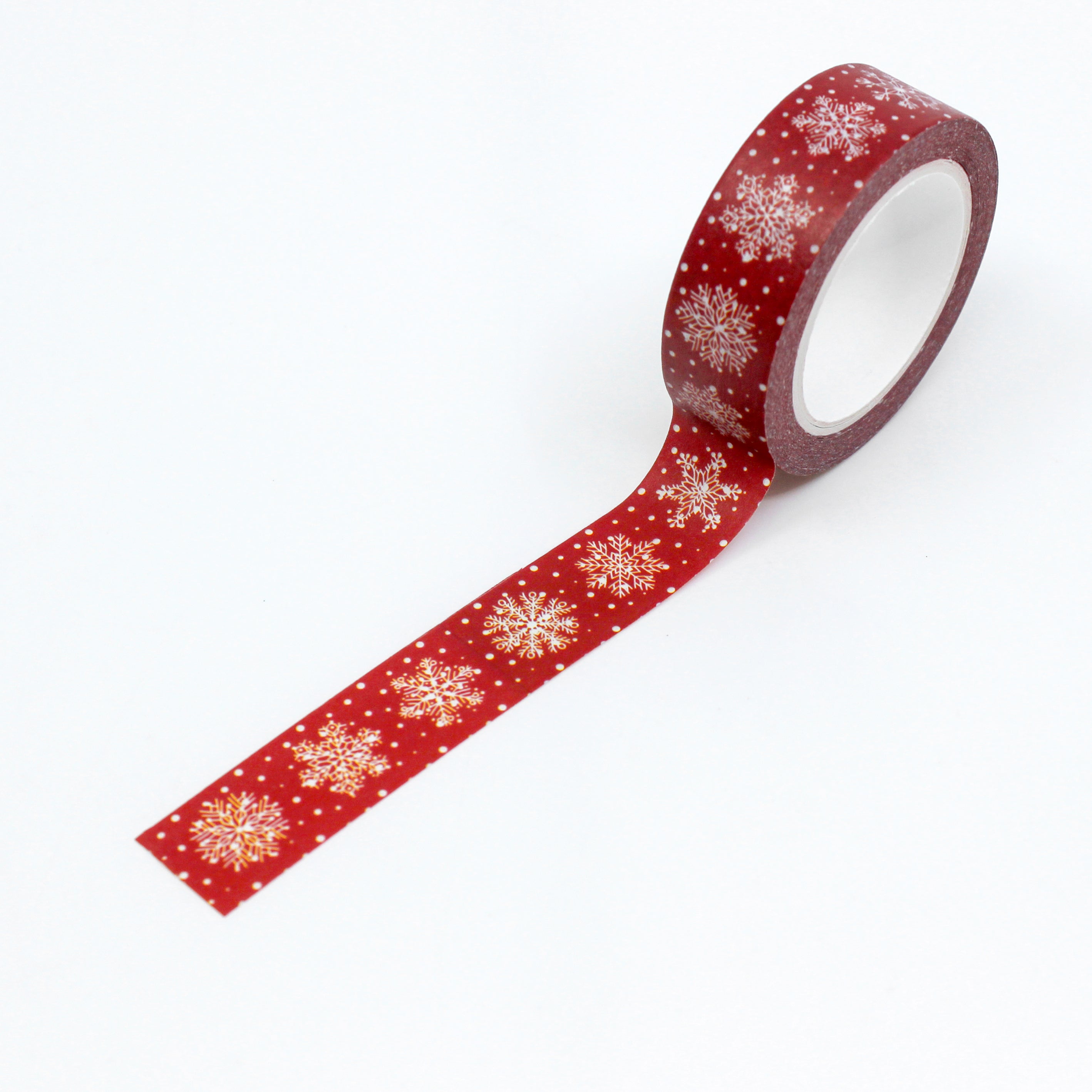 This is a full pattern repeat view of dark red snowflakes washi tape from BBB Supplies Craft Shop