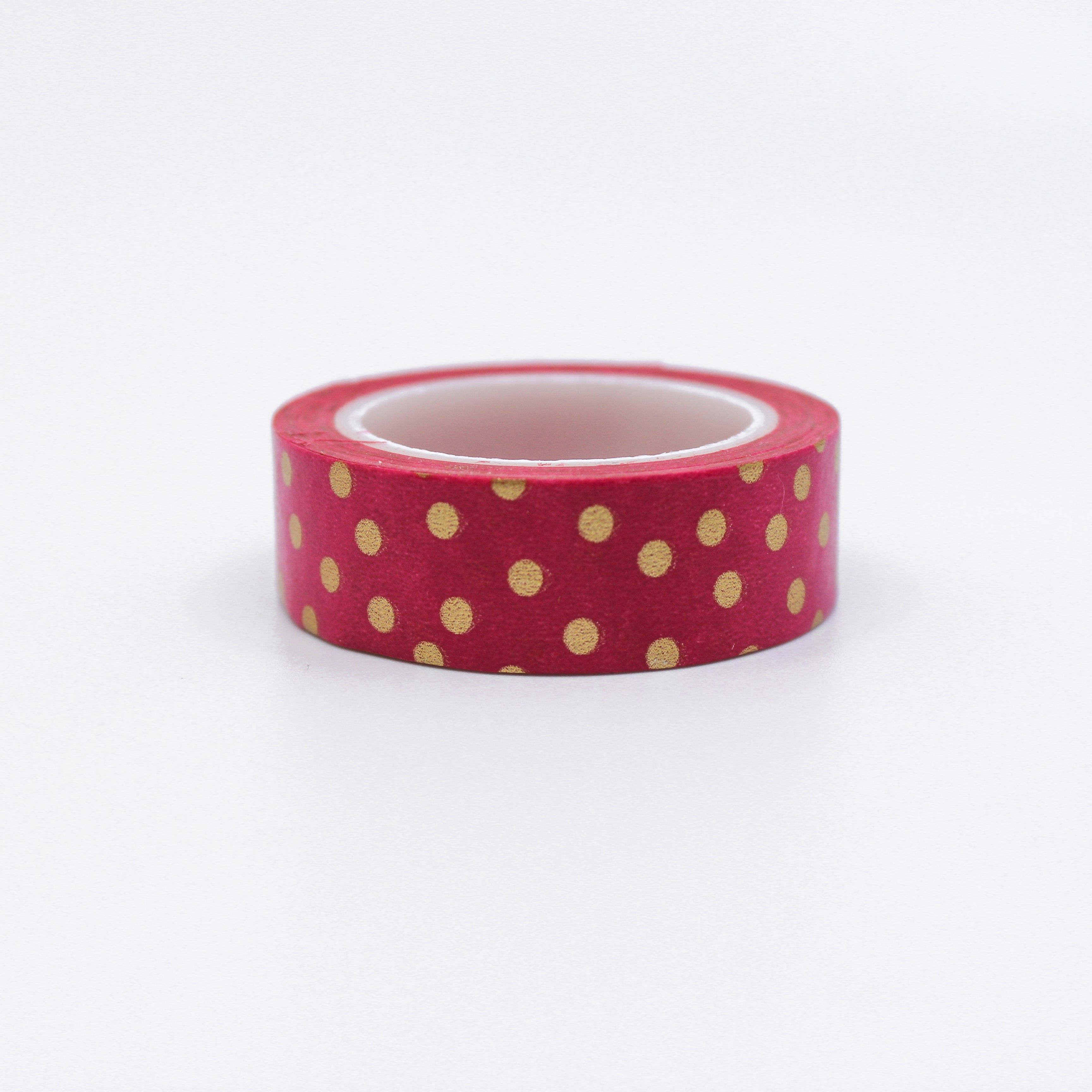 This is a fuchsia with gold foil polka dots pattern washi tape from BBB Supplies Craft Shop