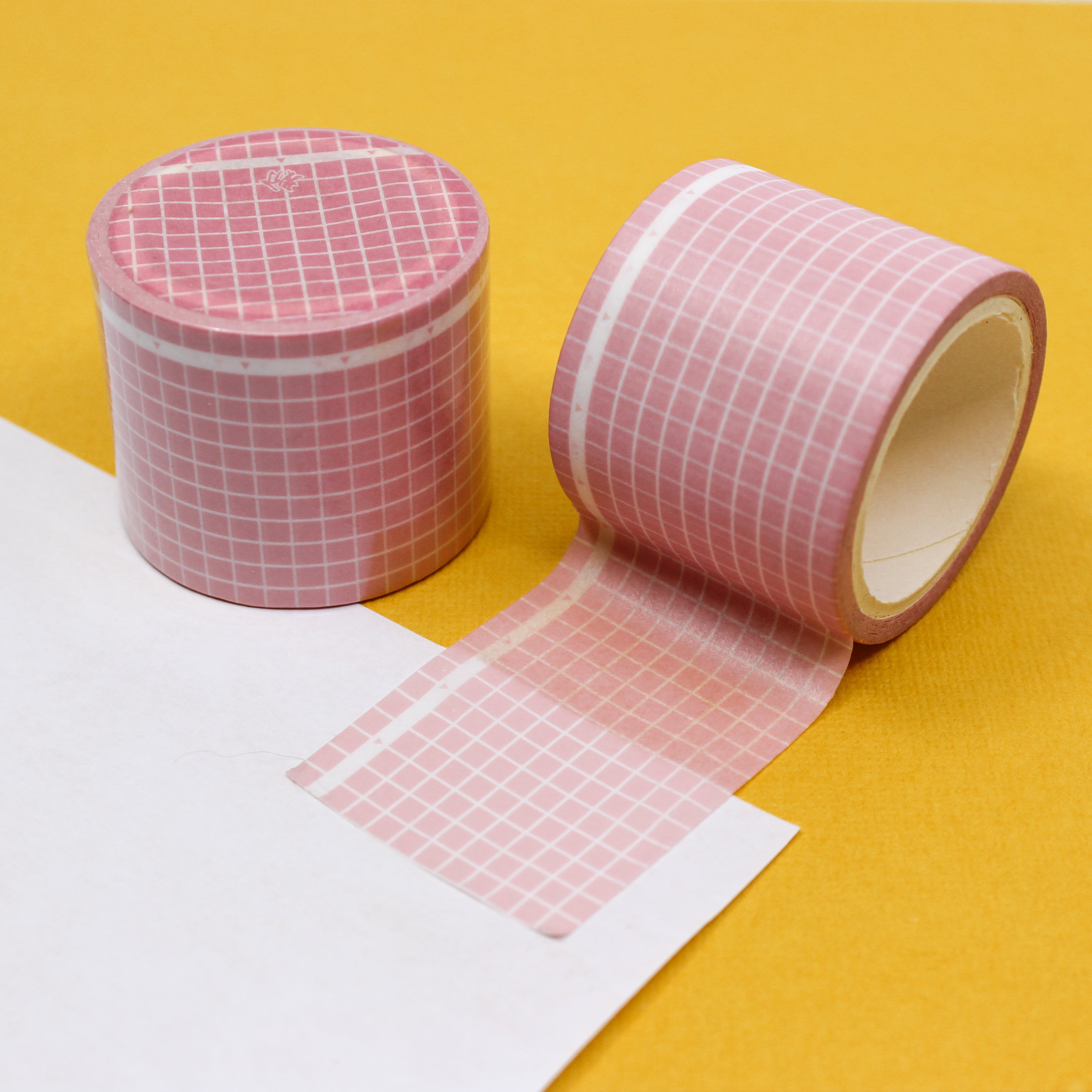 This is a pink wide grid view themed washi tape from BBB Supplies Craft Shop
