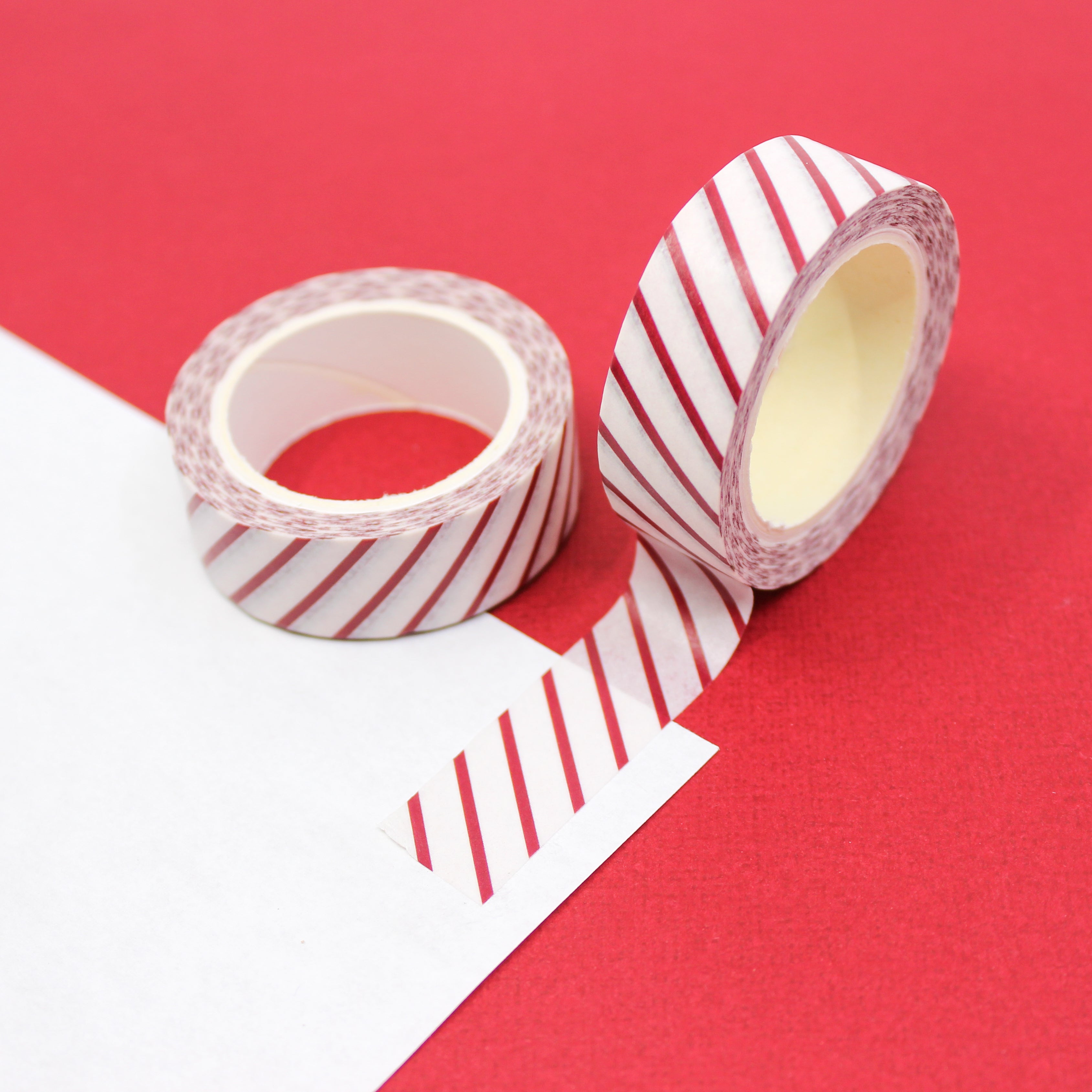This is a red and white diagonal stripe that looks like candy cane view themed washi tape from BBB Supplies Craft Shop
