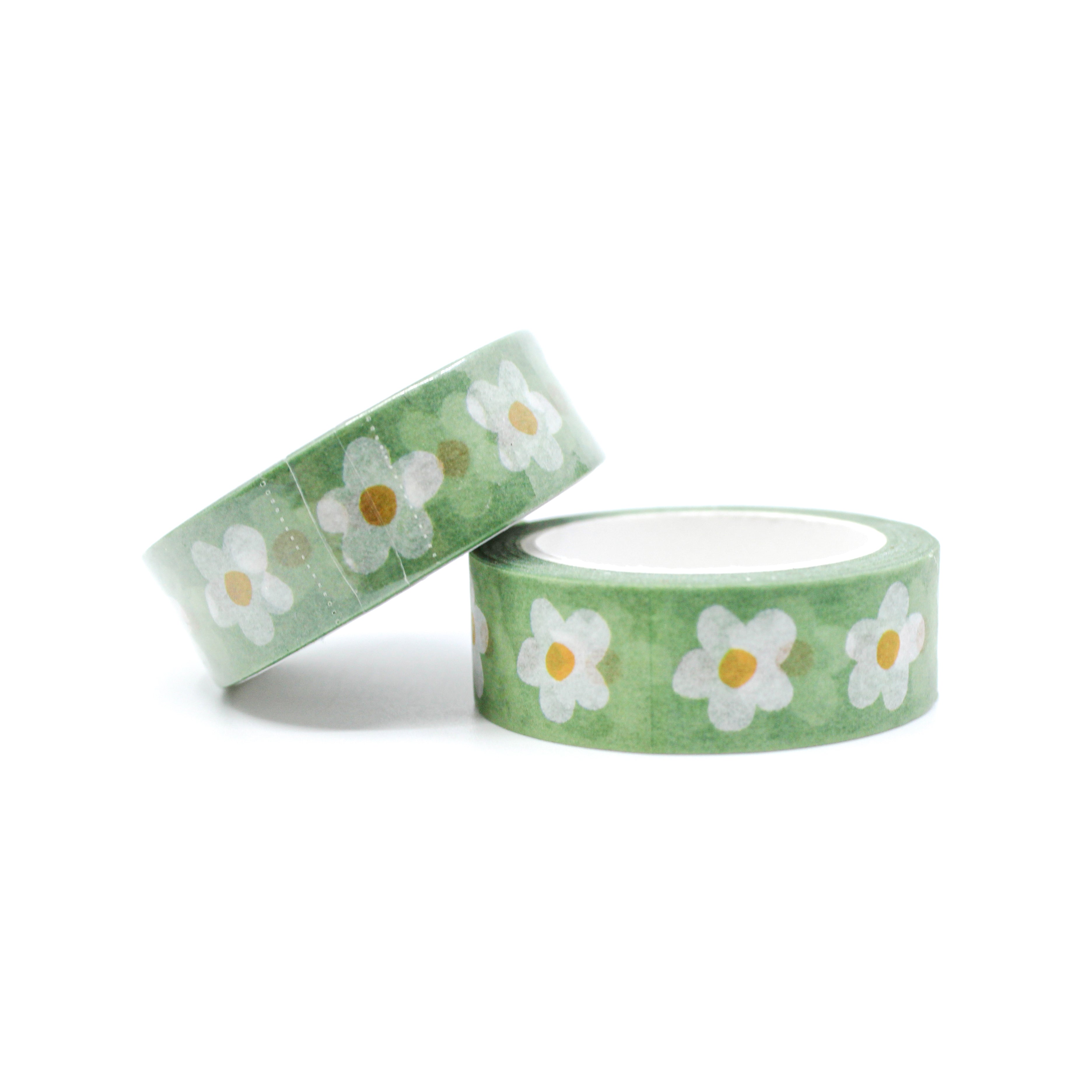 This is a roll of white daisy with green background washi tapes from BBB Supplies Craft Shop