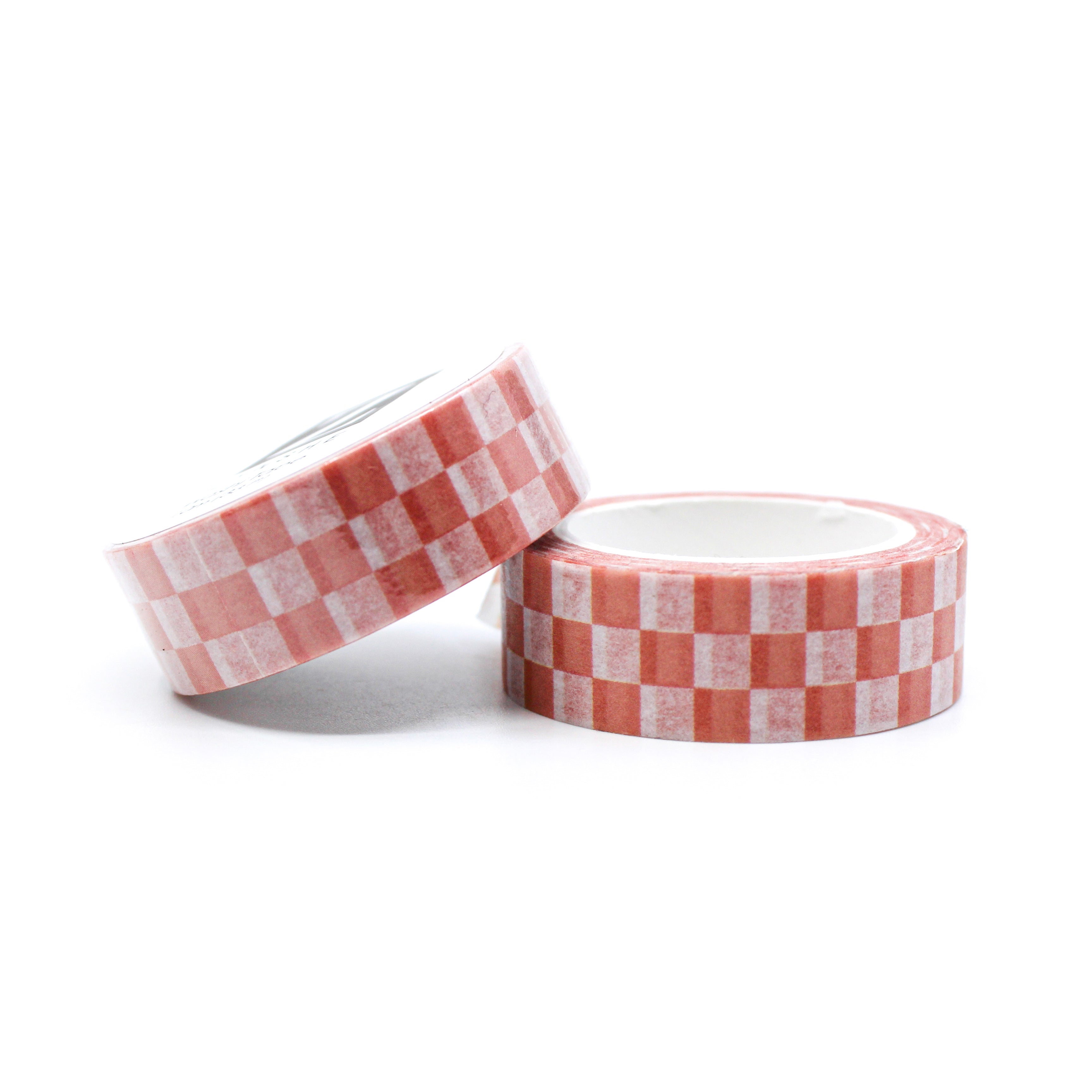 This is a roll of pink checkerboard with white background washi tapes from BBB Supplies Craft Shop