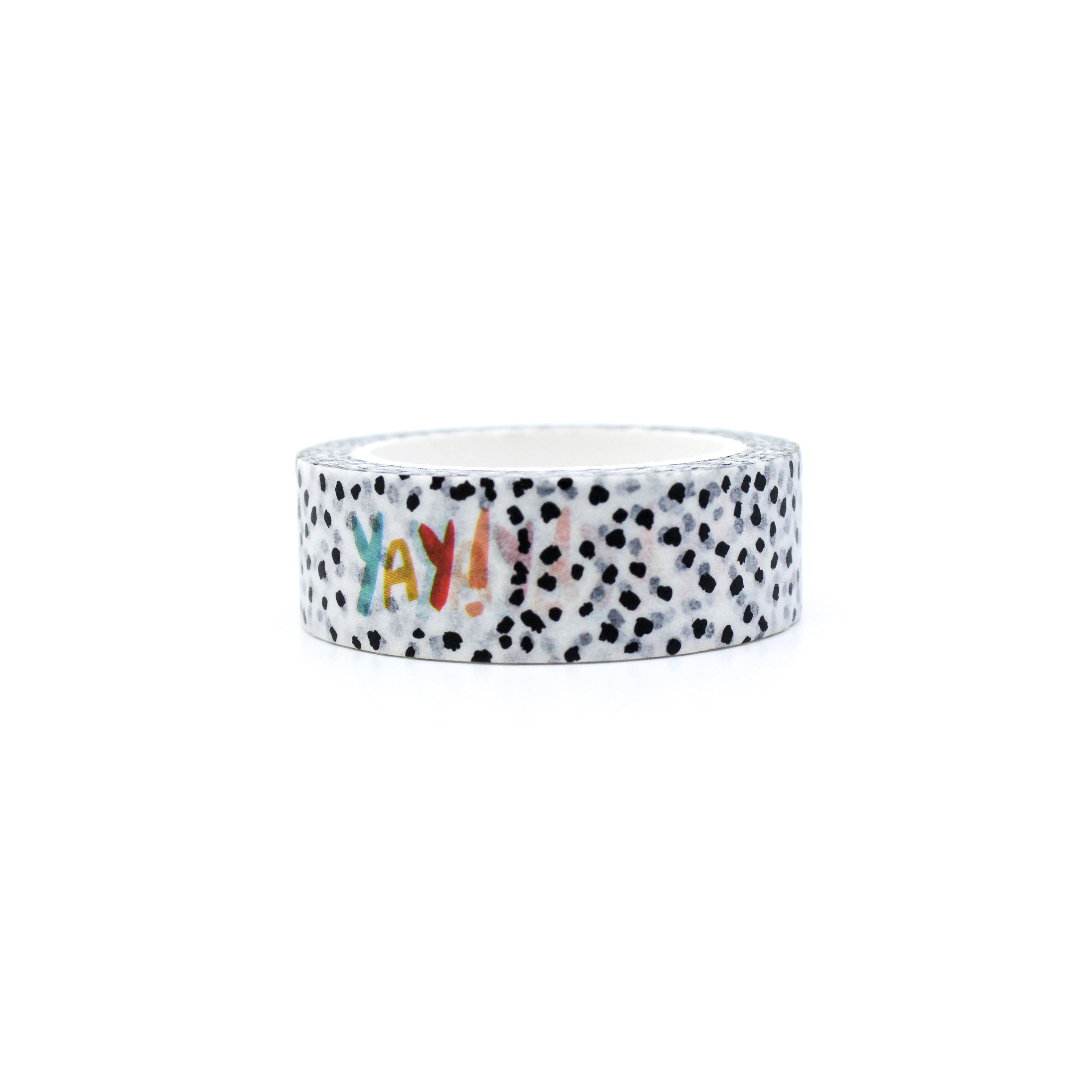 This is the front view of a fun and colorful YAY! Text washi tape on a black and white speckled background from BBB Supplies Craft Shop and created by Zynshe.
