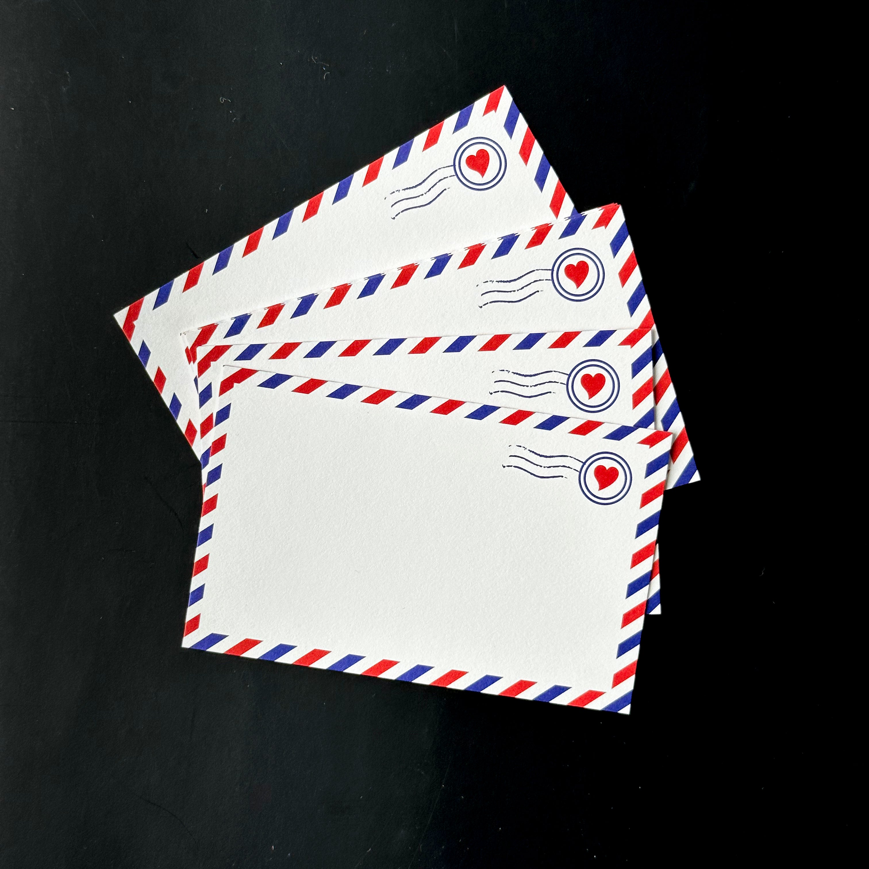 This is a photo of our adorable airmail style mini notecards, perfect for place cards, love notes, gift tags, lunch box notes, and snail mail. These are designed by Kiss and Punch and sold at BBB Supplies Craft Shop.