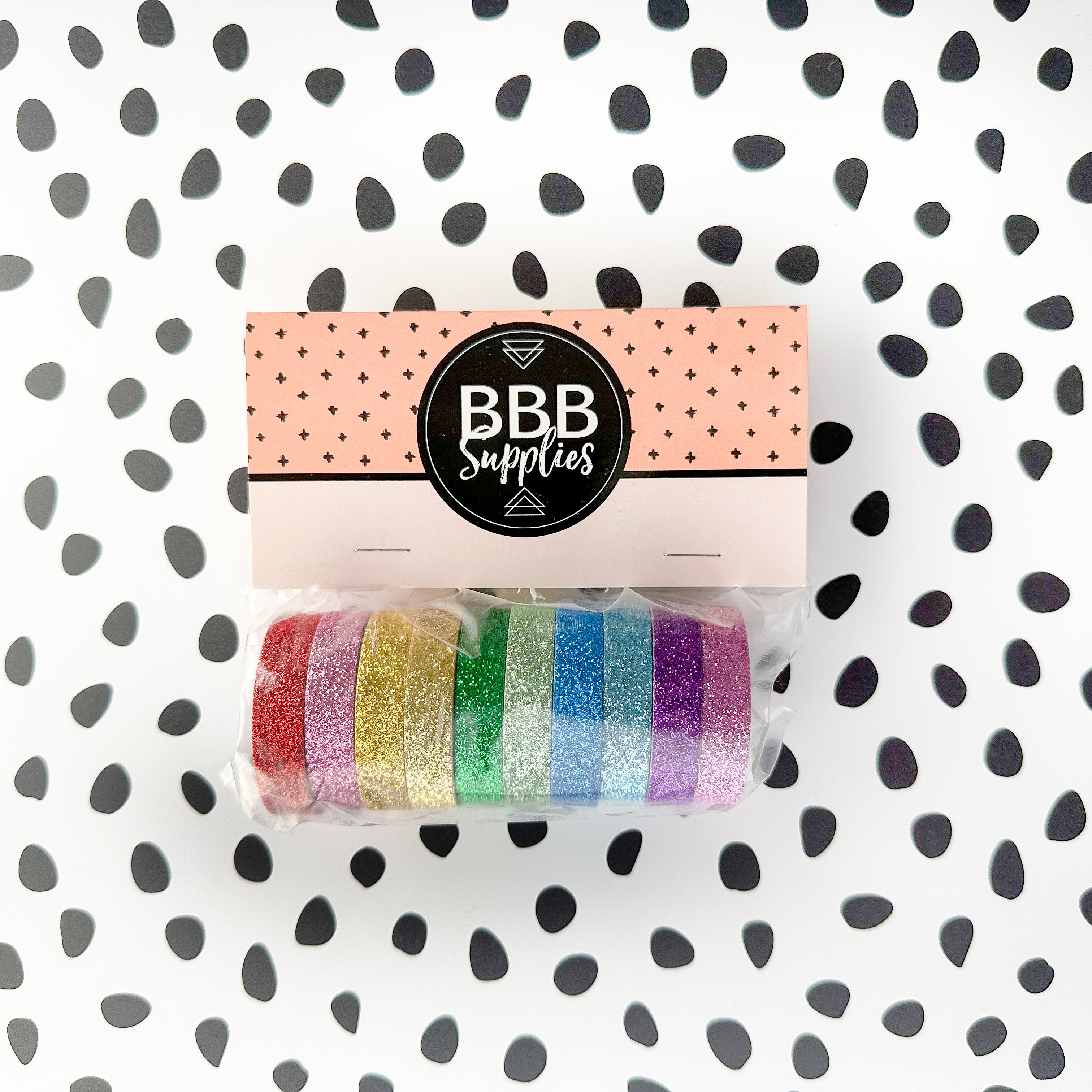 This set of washi tape is perfect for multiple projects. The set includes pastel and primary red, blue, yellow, green, blue, and purple glitter tapes. This tape will add some sparkle to any project. This set is sold at BBB Supplies Craft Shop.