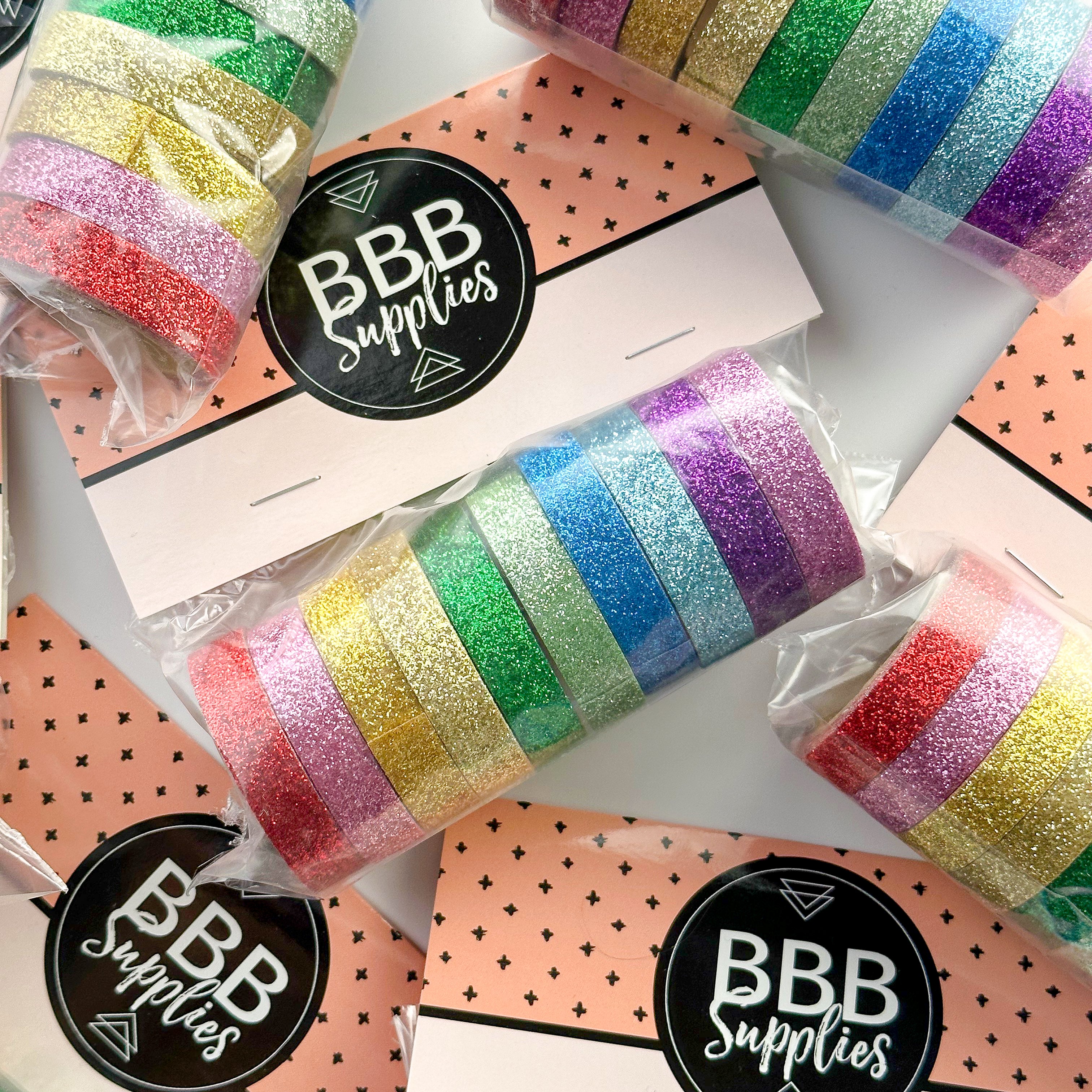 This set of washi tape is perfect for multiple projects. The set includes pastel and primary red, blue, yellow, green, blue, and purple glitter tapes. This tape will add some sparkle to any project. This set is sold at BBB Supplies Craft Shop.