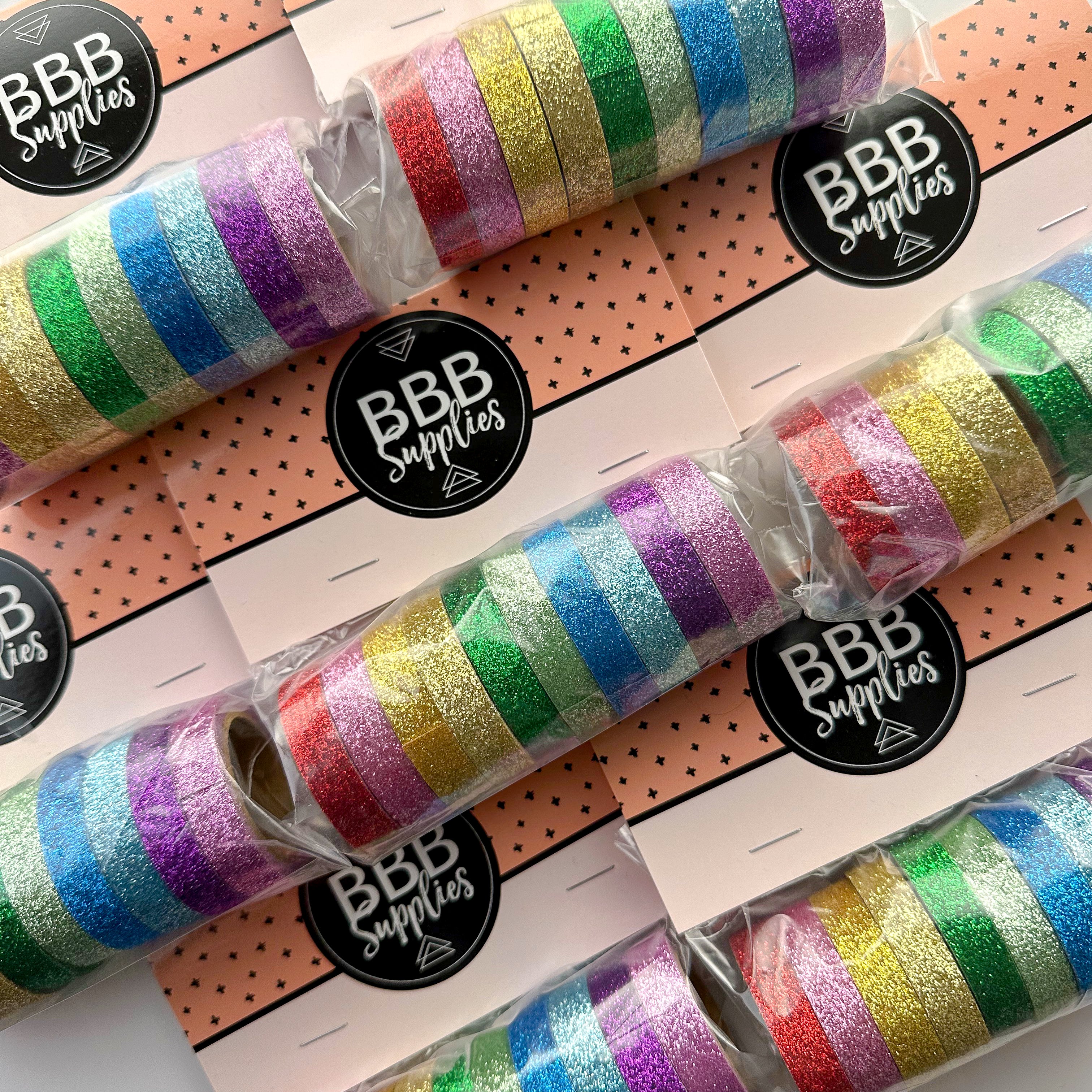 This set of washi tape is perfect for multiple projects. The set includes pastel and primary red, blue, yellow, green, blue, and purple glitter tapes. This tape will add some sparkle to any project. This set is sold at BBB Supplies Craft Shop.