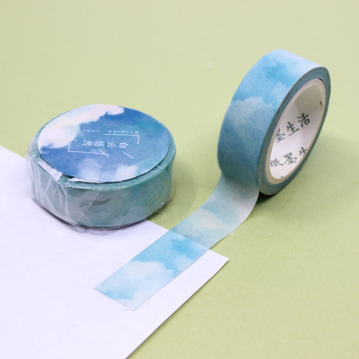 This blue clouds in the sky watercolor washi tape is the perfect addition to your washi collection. The simplicity of the pattern is perfect for accenting and matching any project's theme while adding a beautiful and interesting pattern. This tape is sold at BBB Supplies Craft Shop.