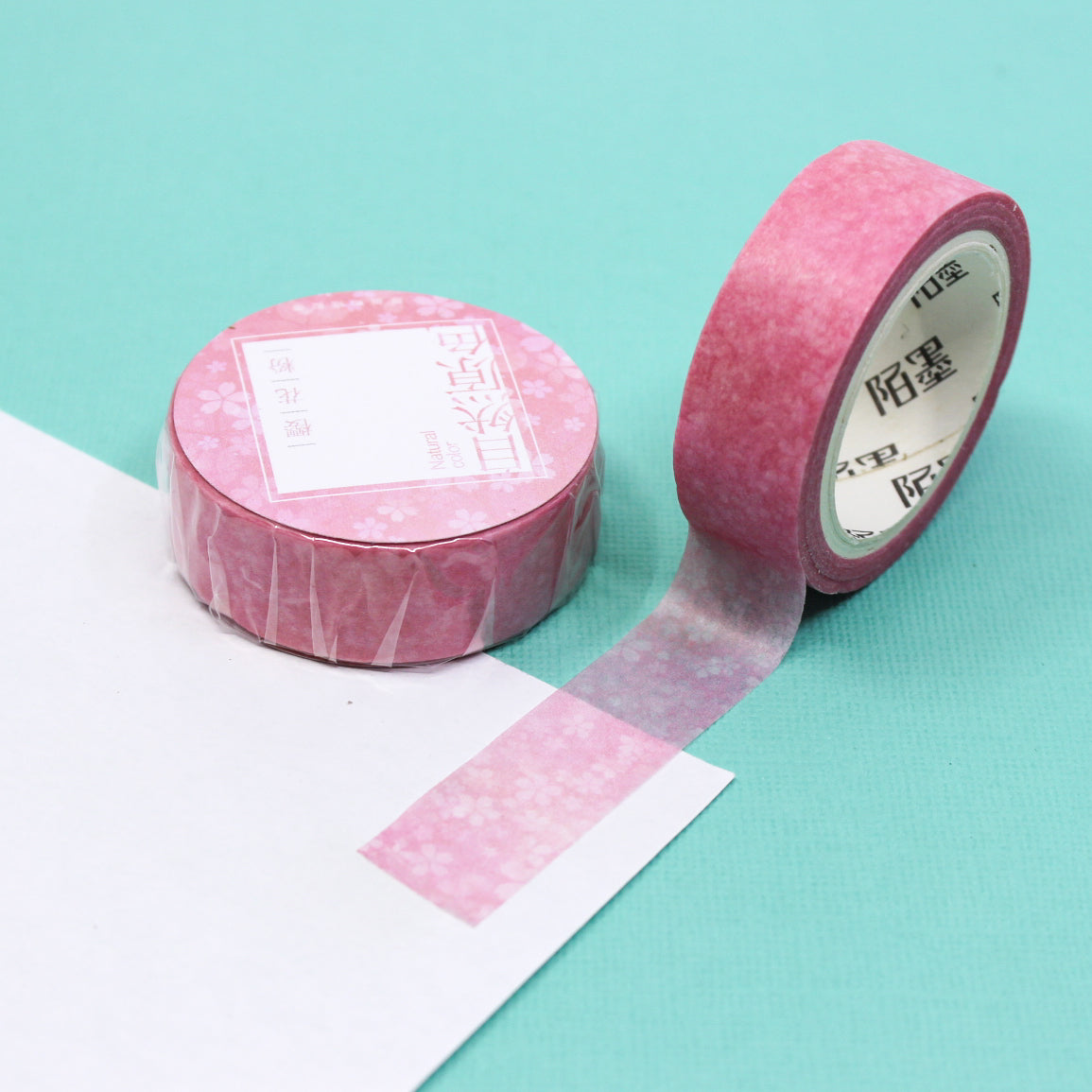 This pink little flowers watercolor washi tape is the perfect addition to your washi collection. The simplicity of the pattern is perfect for accenting and matching any project's theme while adding a beautiful and interesting pattern. This tape is sold at BBB Supplies Craft Shop.