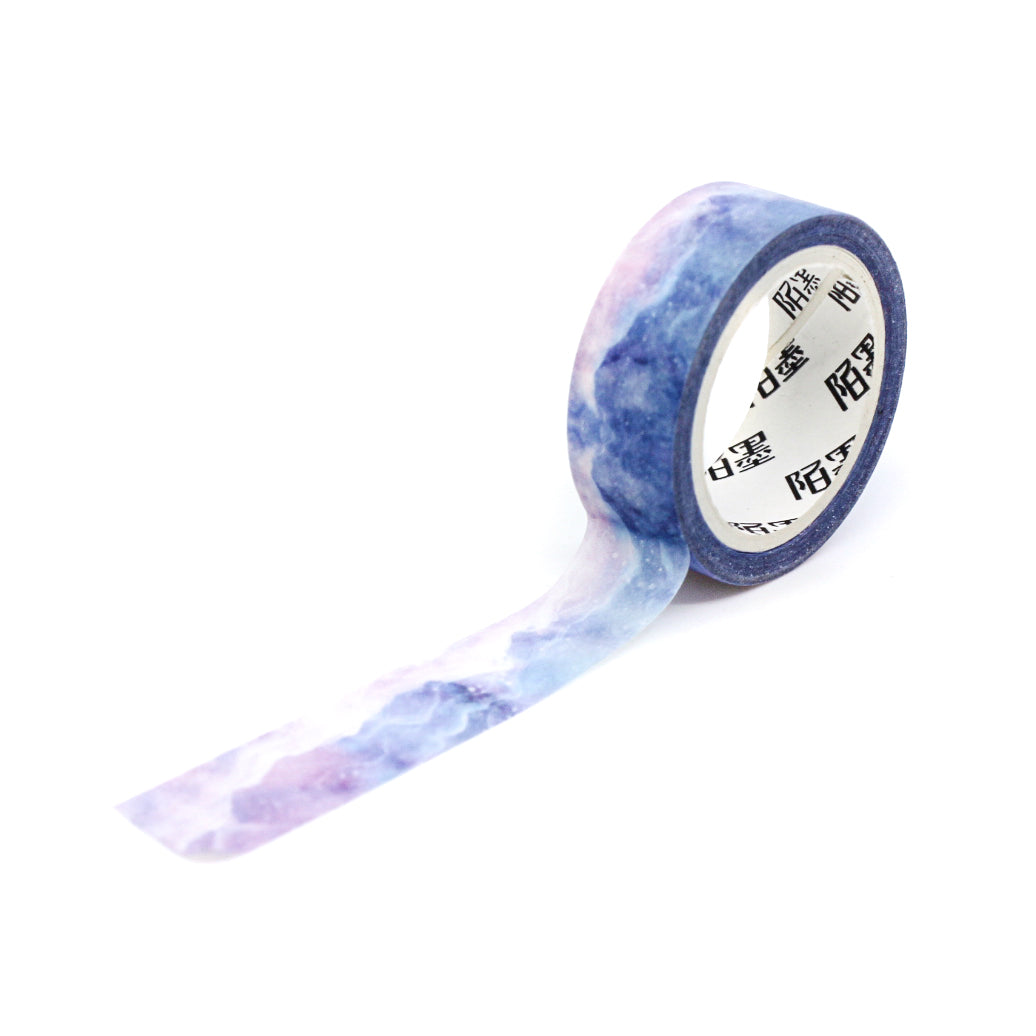 This purple crystal mountain watercolor washi tape is the perfect addition to your washi collection. This tape resembles a cloudy sky at sunrise. The simplicity of the pattern is perfect for accenting and matching any project's theme while adding a beautiful and interesting pattern. This tape is from BBB Supplies Craft Shop.