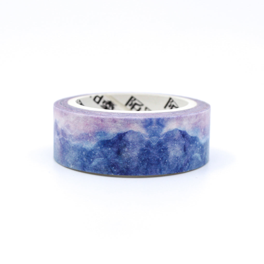 This purple crystal mountain watercolor washi tape is the perfect addition to your washi collection. This tape resembles a cloudy sky at sunrise. The simplicity of the pattern is perfect for accenting and matching any project's theme while adding a beautiful and interesting pattern. This tape is from BBB Supplies Craft Shop.