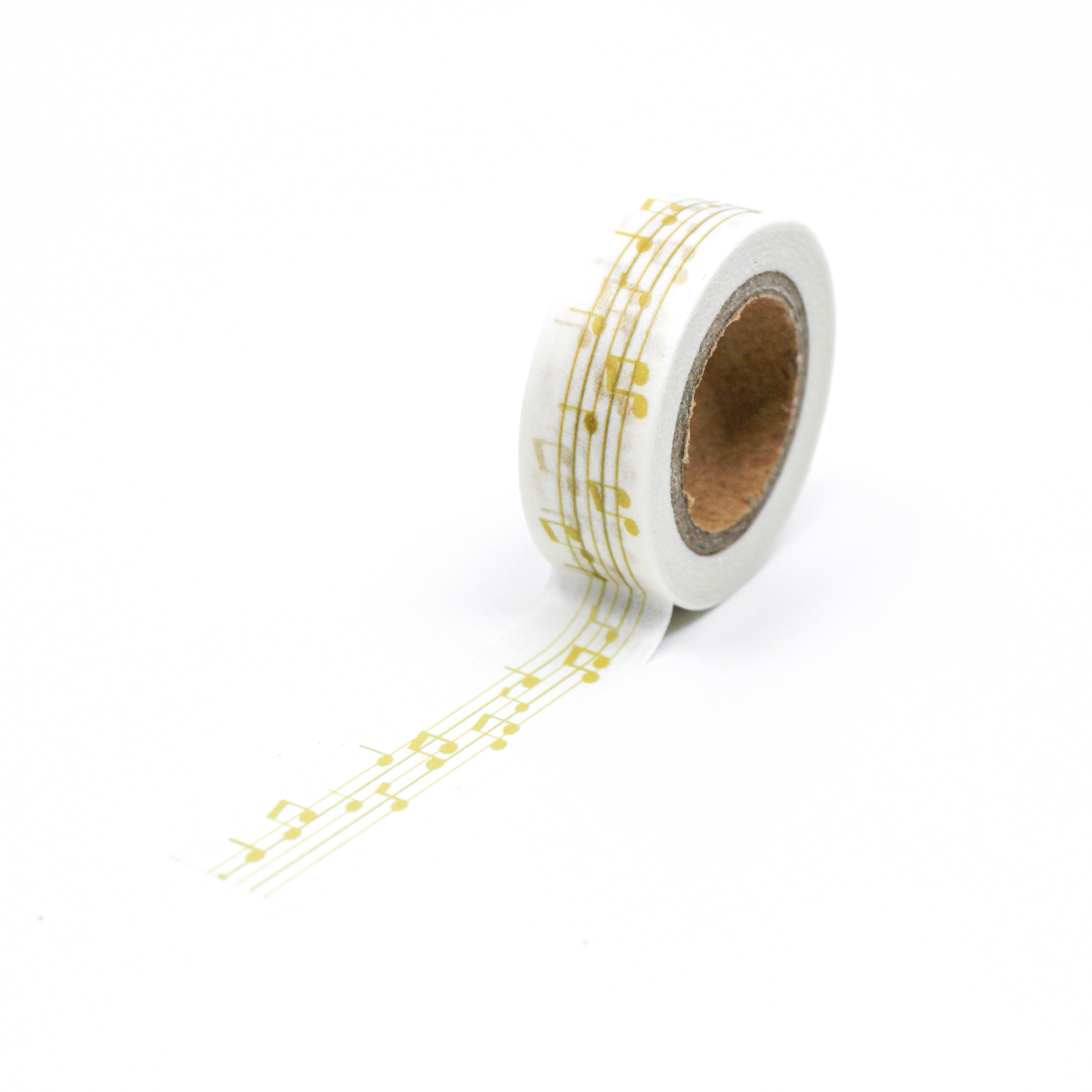 This is a full pattern repeat view of yellow music notes washi tape from BBB Supplies Craft Shop