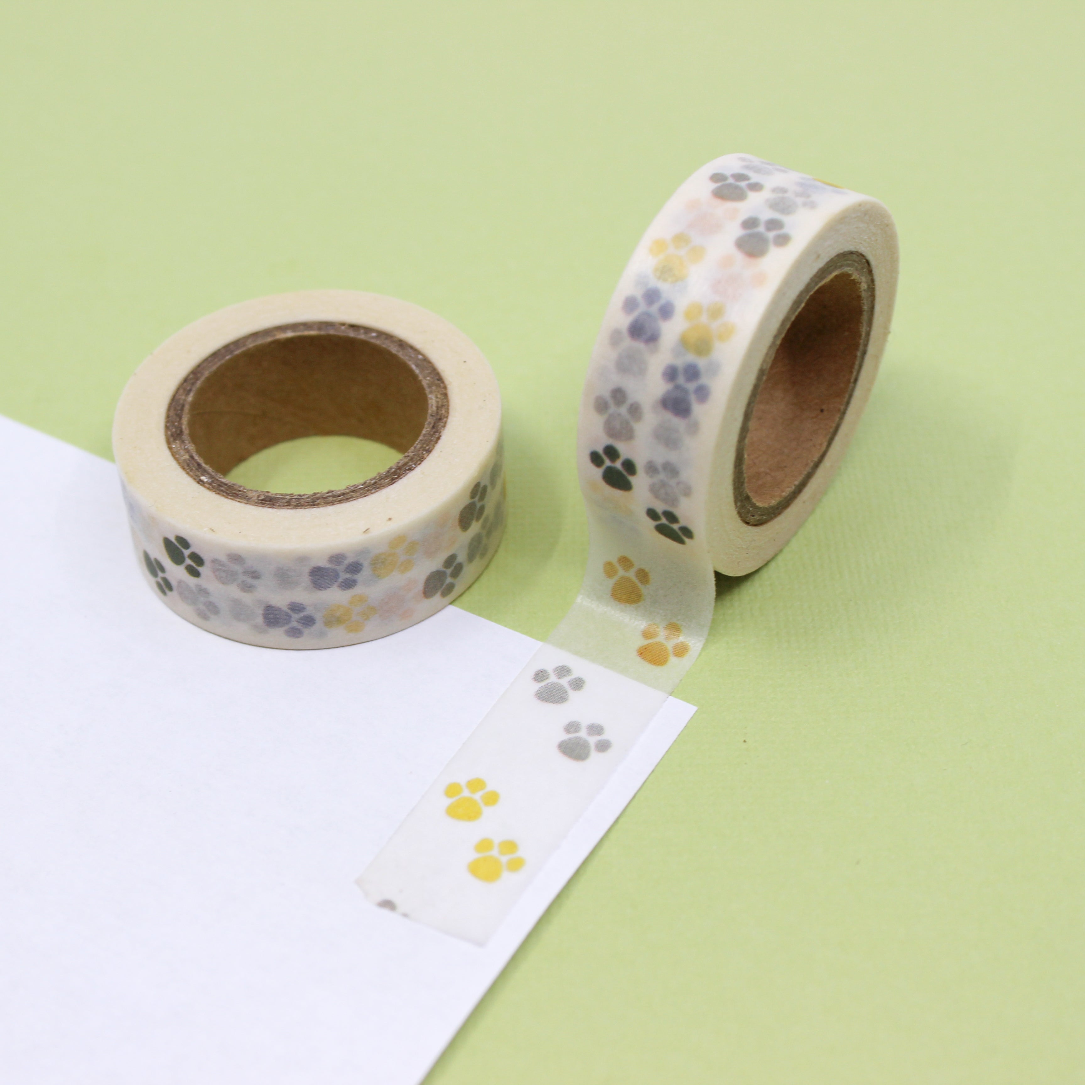 This is a yellow, black and grey paw prints of animal Washi Tape from BBB Supplies Craft Shop