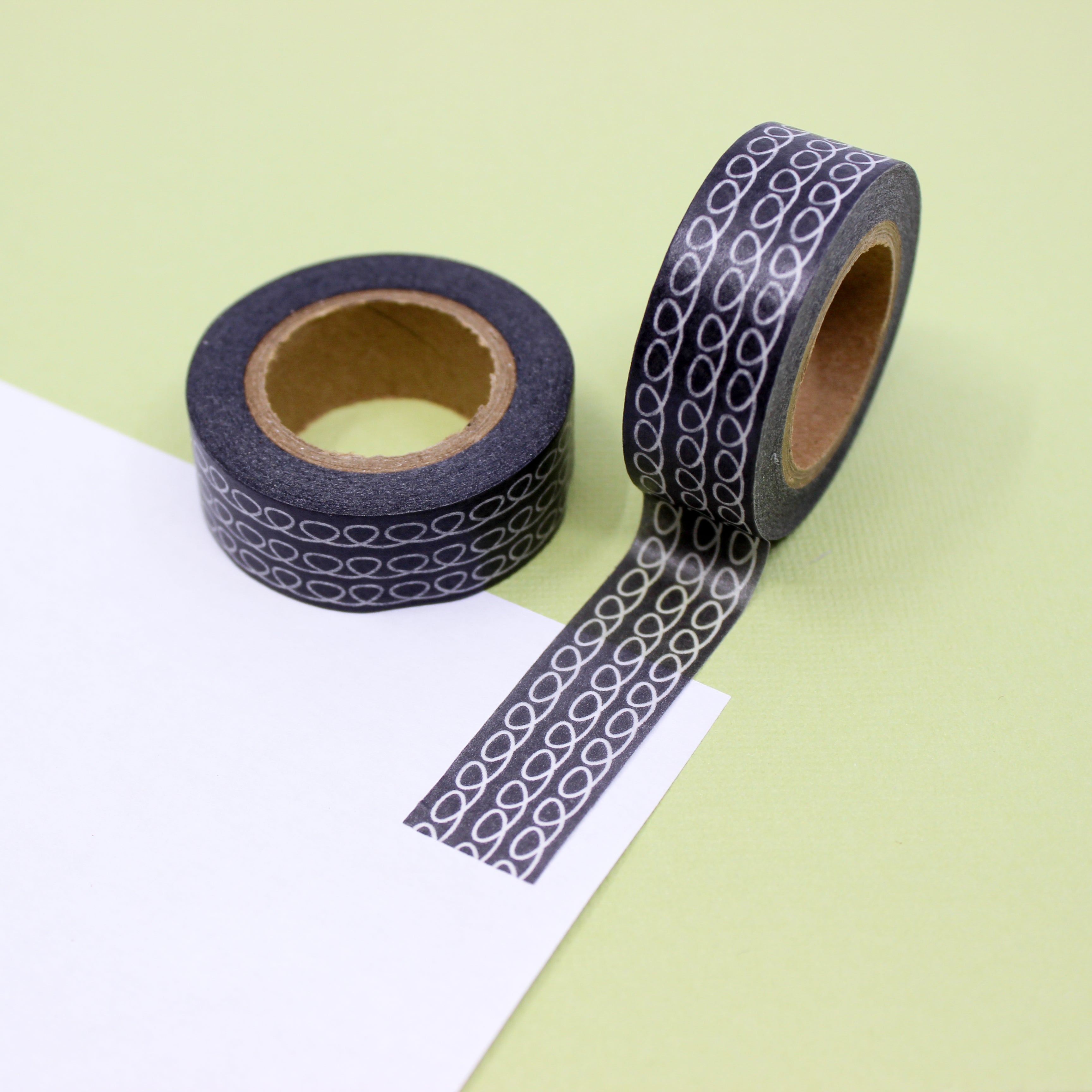 This is a black tape with swirl lines view themed washi tape from BBB Supplies Craft Shop