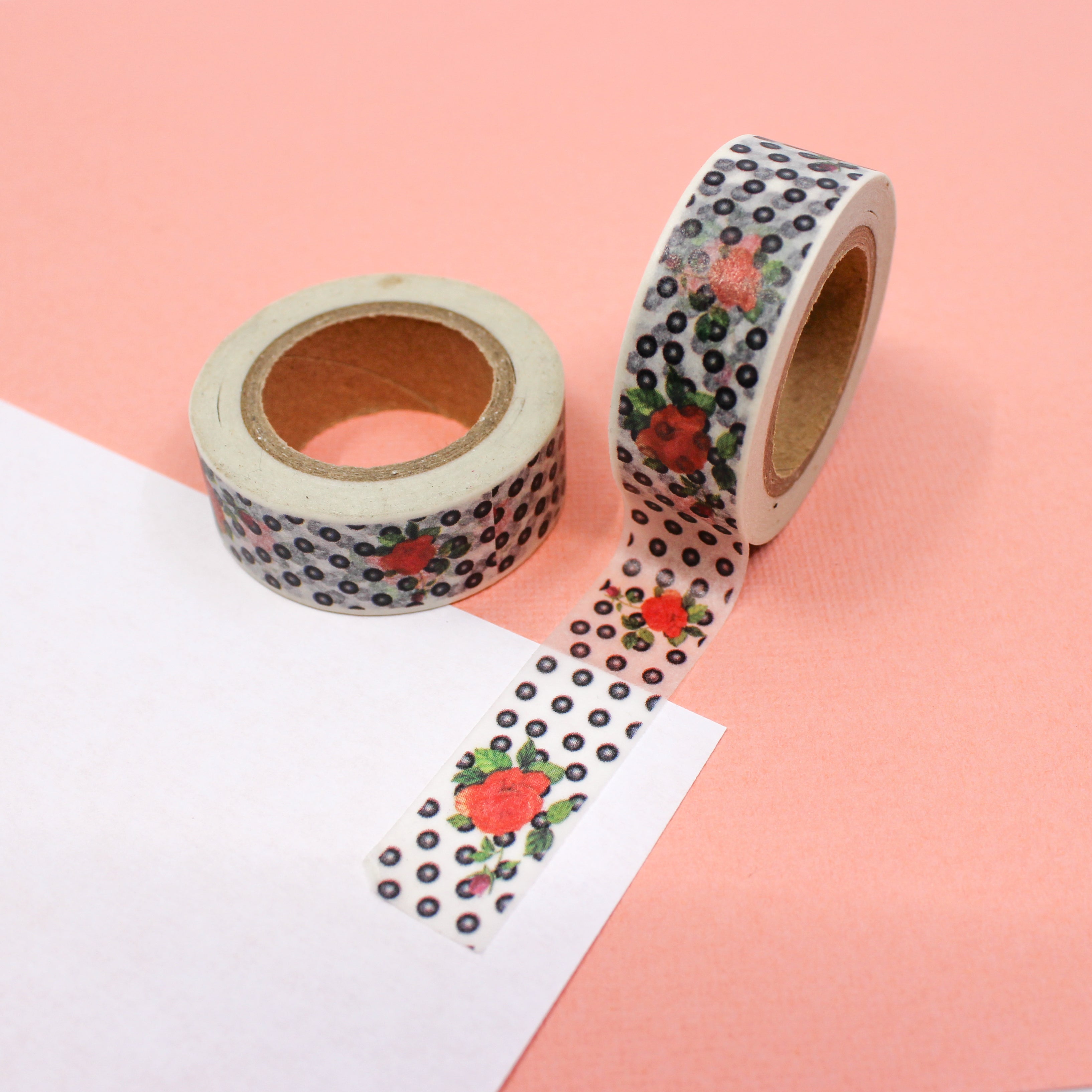 This is a tiny black dots and orange Hawaiian flowers pattern washi tape from BBB Supplies Craft Shop