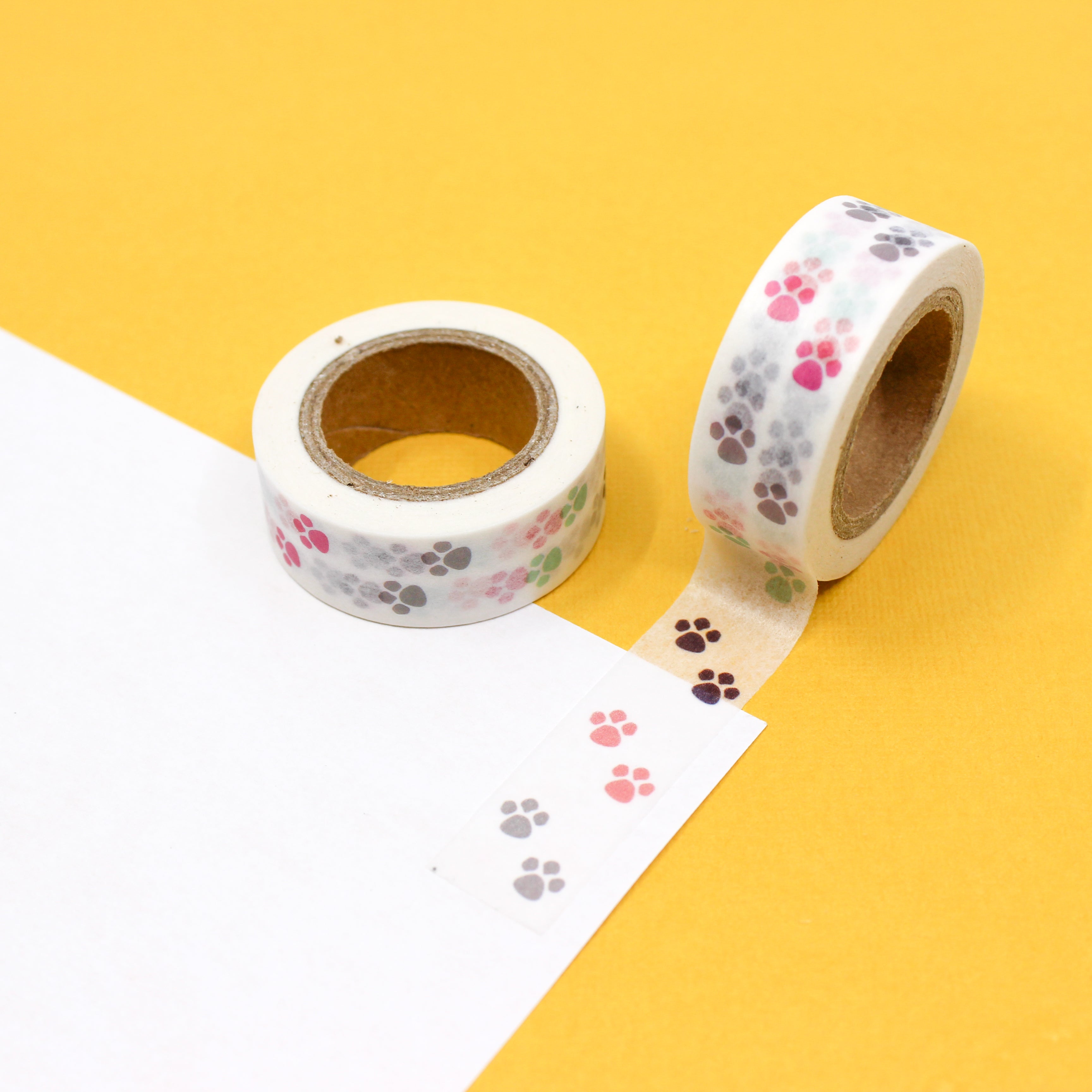 This is a colorful pink and grey animal paw prints view themed washi tape from BBB Supplies Craft Shop