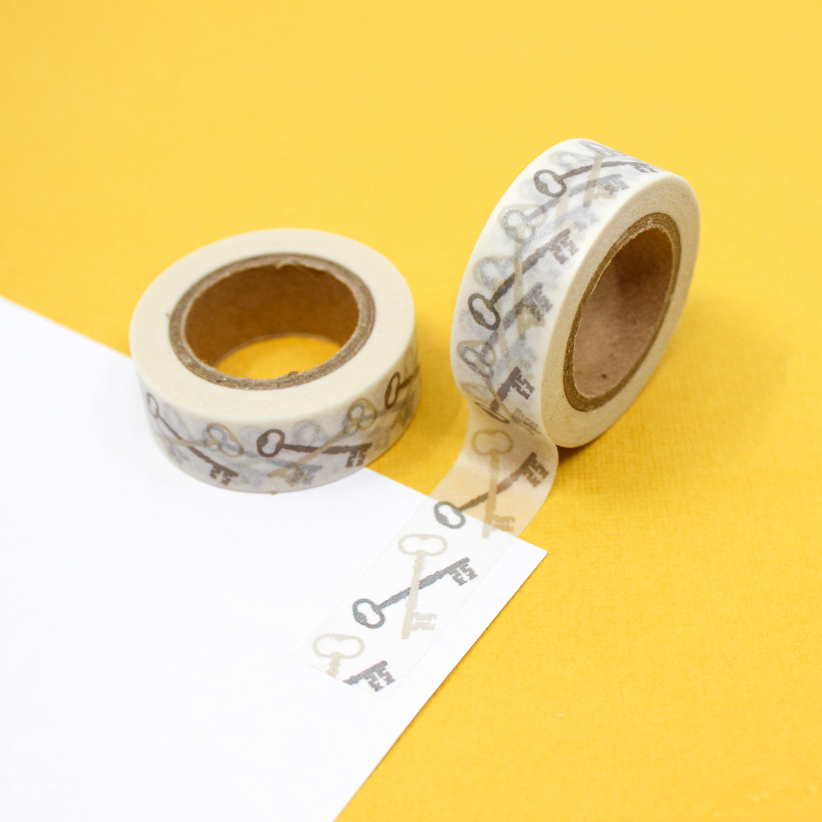 This is a gold color of vintage keys washi tape from BBB Supplies Craft Shop