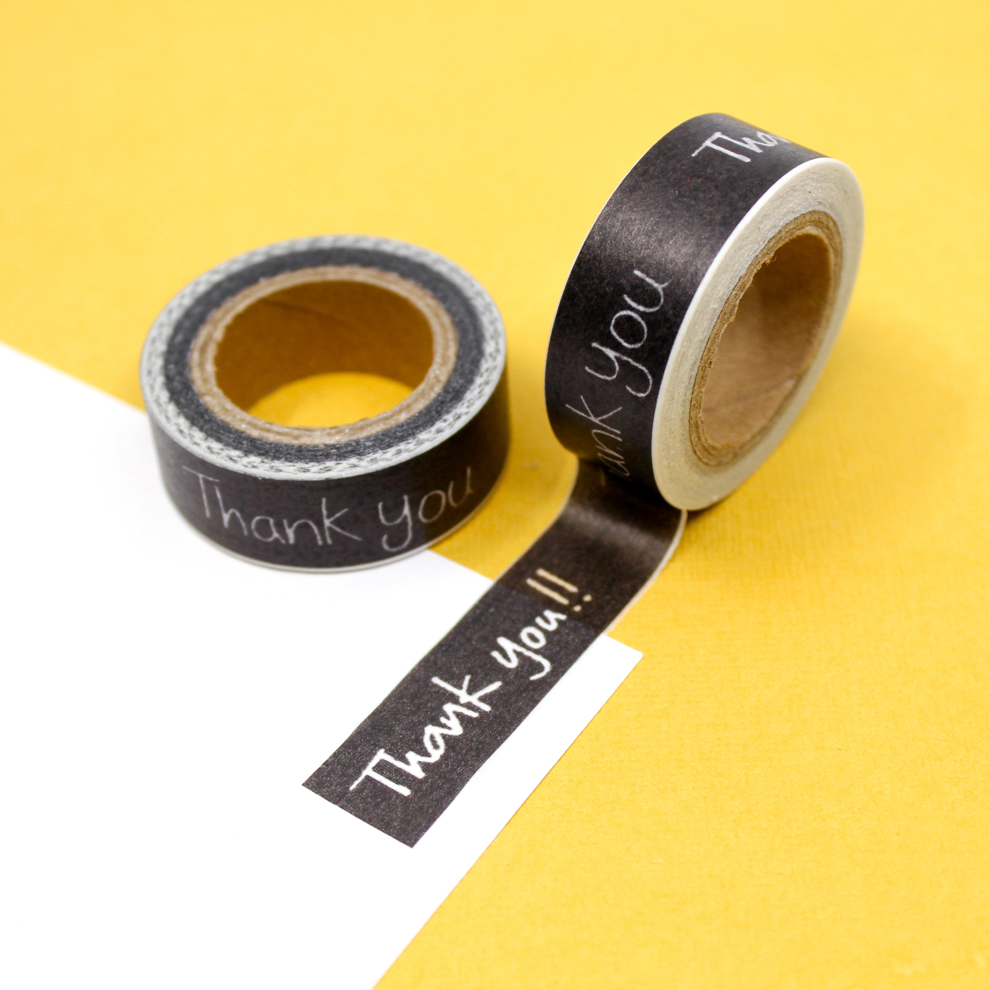 This is a black handwritten Thank You! text washi tape from BBB Supplies Craft Shop