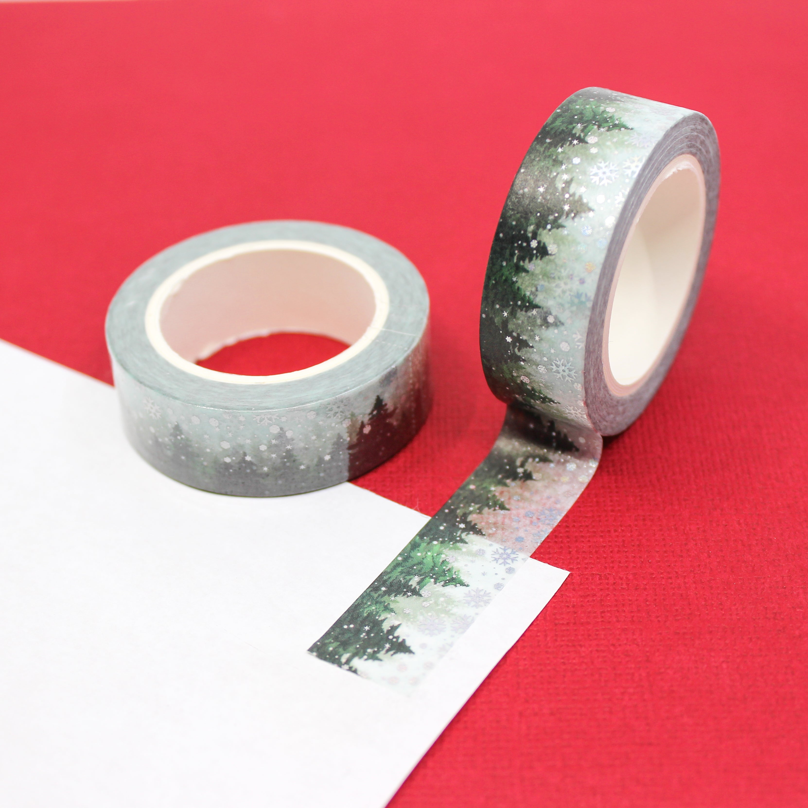 This is a green tree line with snow Washi Tape from BBB Supplies Craft Shop