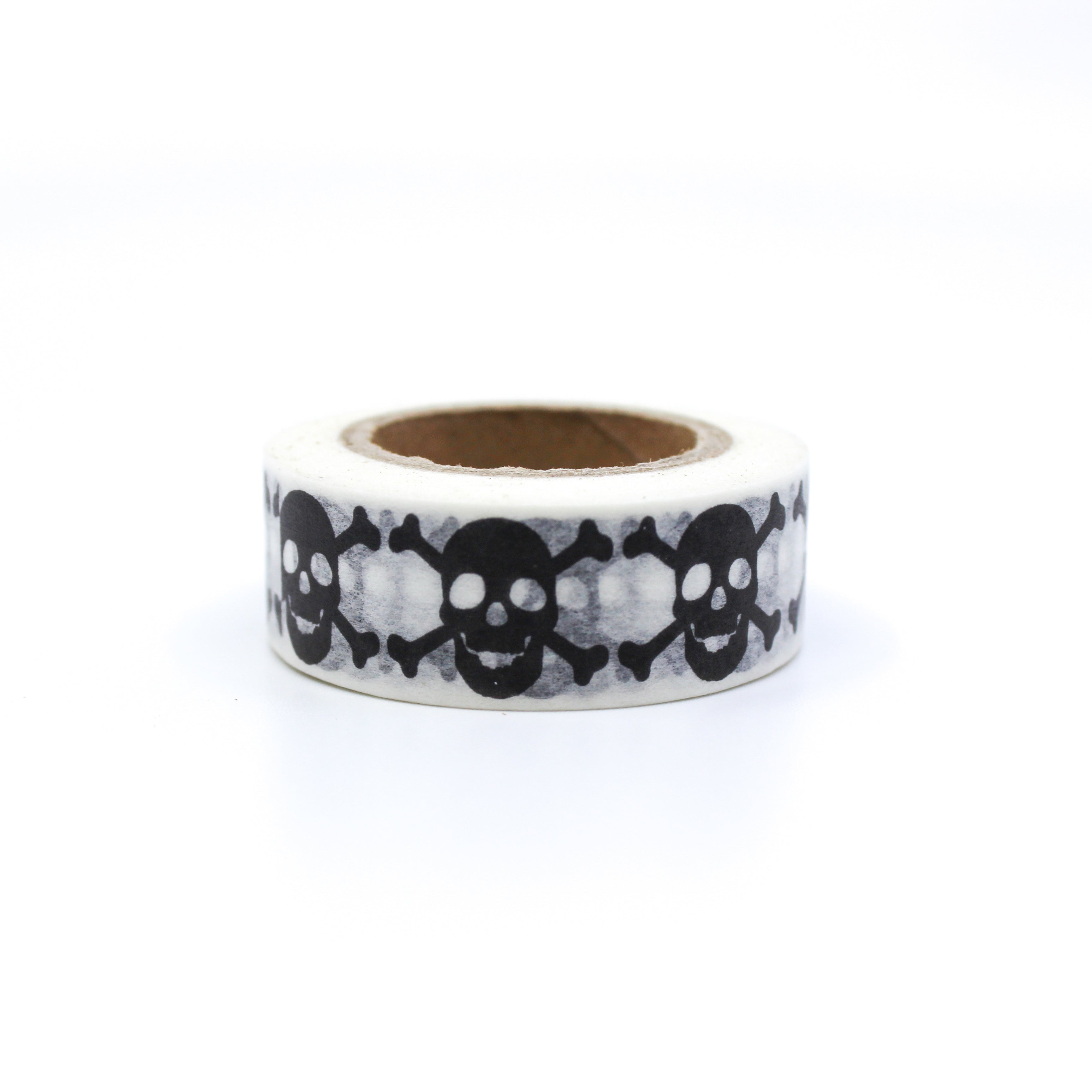 This is a black skulls with bones in a white background washi tape from BBB Supplies Craft Shop