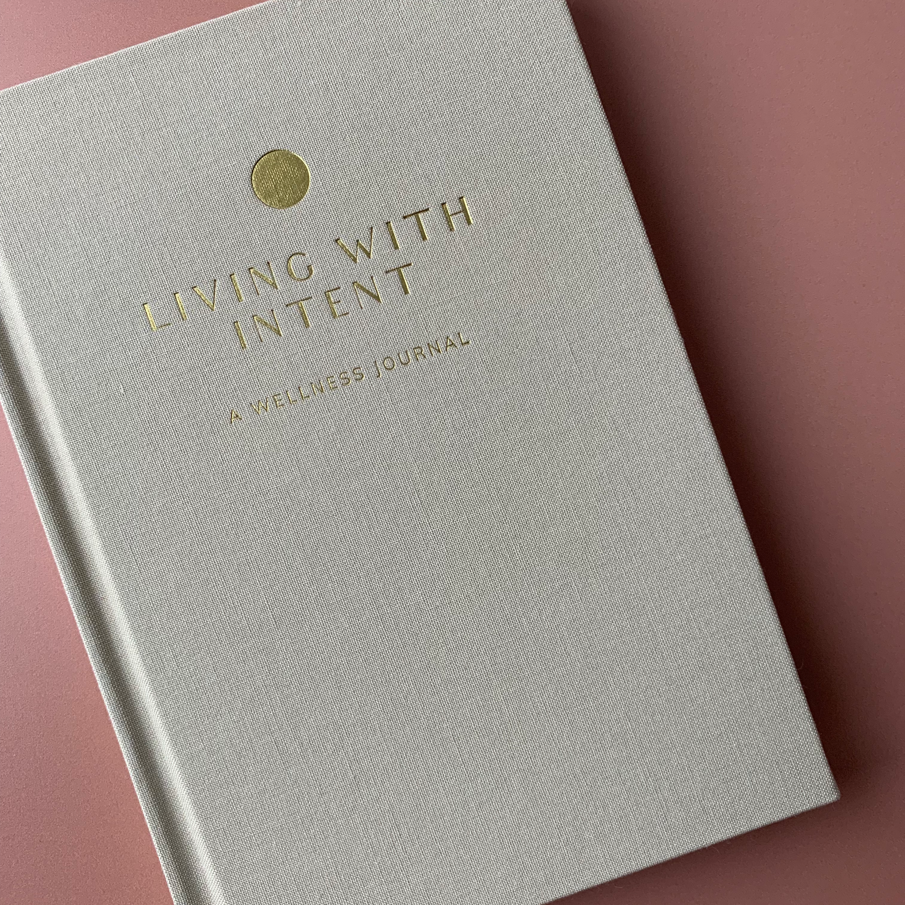 Living with Intent Journal featuring guided prompts for mindfulness, self-reflection, goal-setting, and daily habit tracking for a purposeful and intentional life.