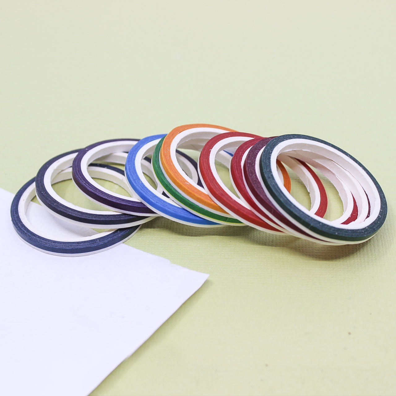 Solid color washi tape rolls with thin stripe border design