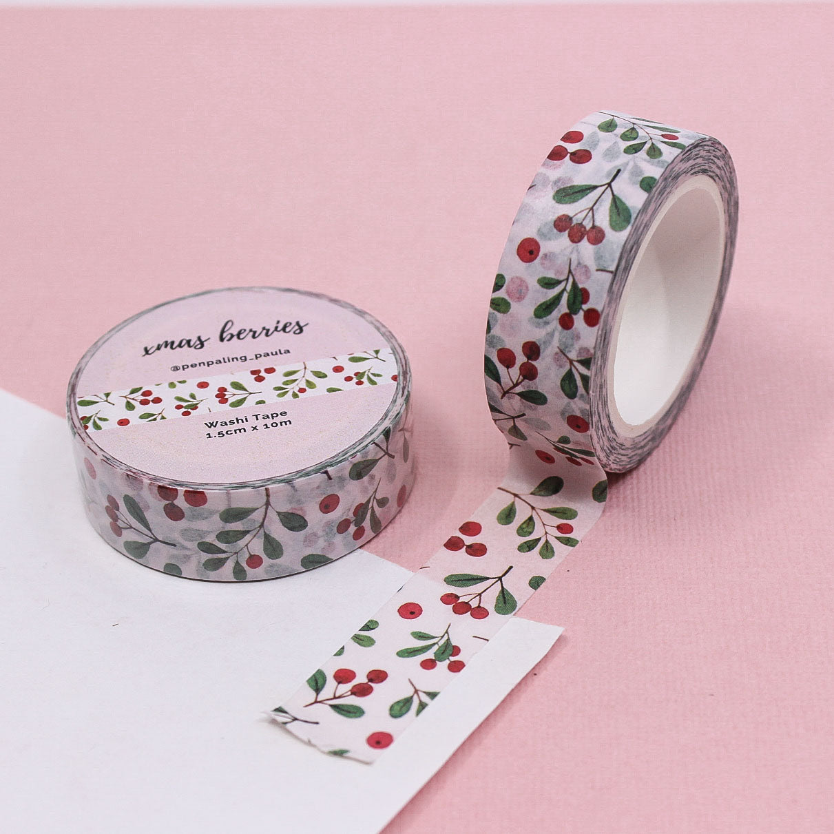 Soft pink berry branch washi tape roll ideal for planners, gift wrapping, and holiday journaling projects.