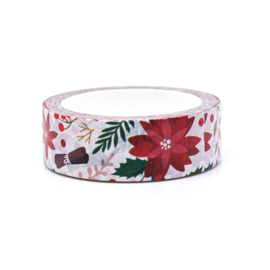 Close-up of floral Christmas washi tape featuring poinsettias and tiny gift illustrations for journaling and crafts.