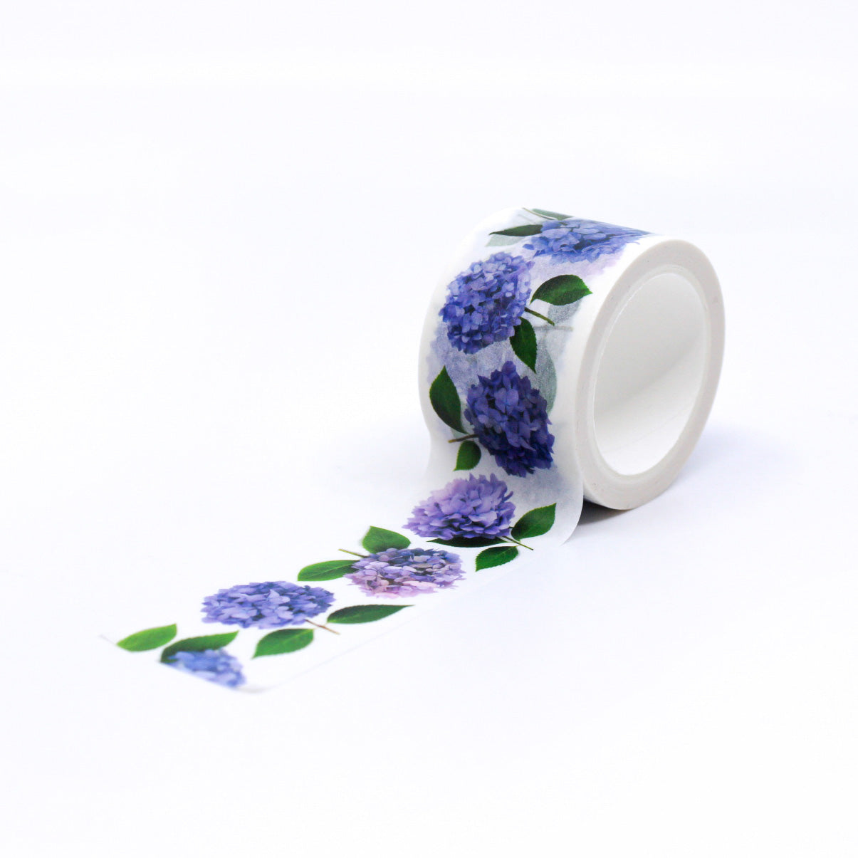 Hydrangea Floral Washi Tape features vibrant hydrangea blooms in various shades of blue, pink, and purple, set against a white background. Perfect for adding a floral touch to your crafts, this tape is ideal for scrapbooking, card making, or decorating journals. This tape is from Bottle Branch Designs and sold at BBB Supplies Craft Shop.