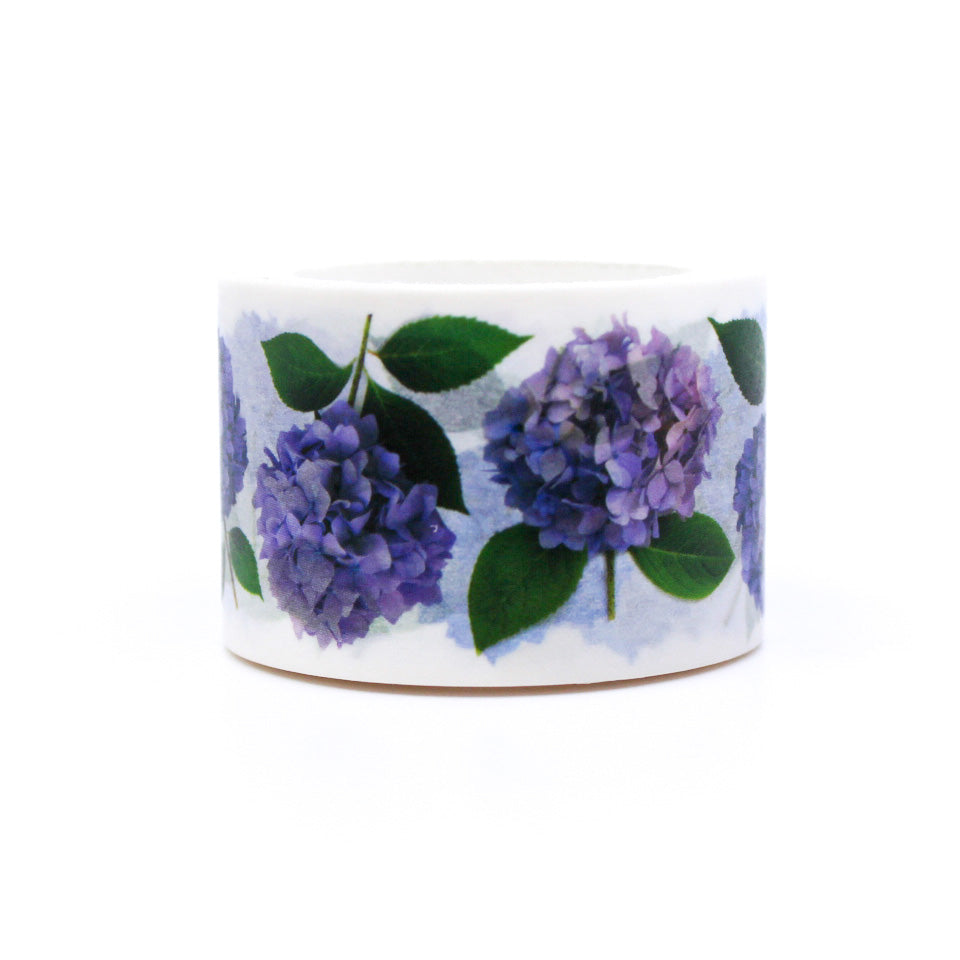 Hydrangea Floral Washi Tape features vibrant hydrangea blooms in various shades of blue, pink, and purple, set against a white background. Perfect for adding a floral touch to your crafts, this tape is ideal for scrapbooking, card making, or decorating journals. This tape is from Bottle Branch Designs and sold at BBB Supplies Craft Shop.
