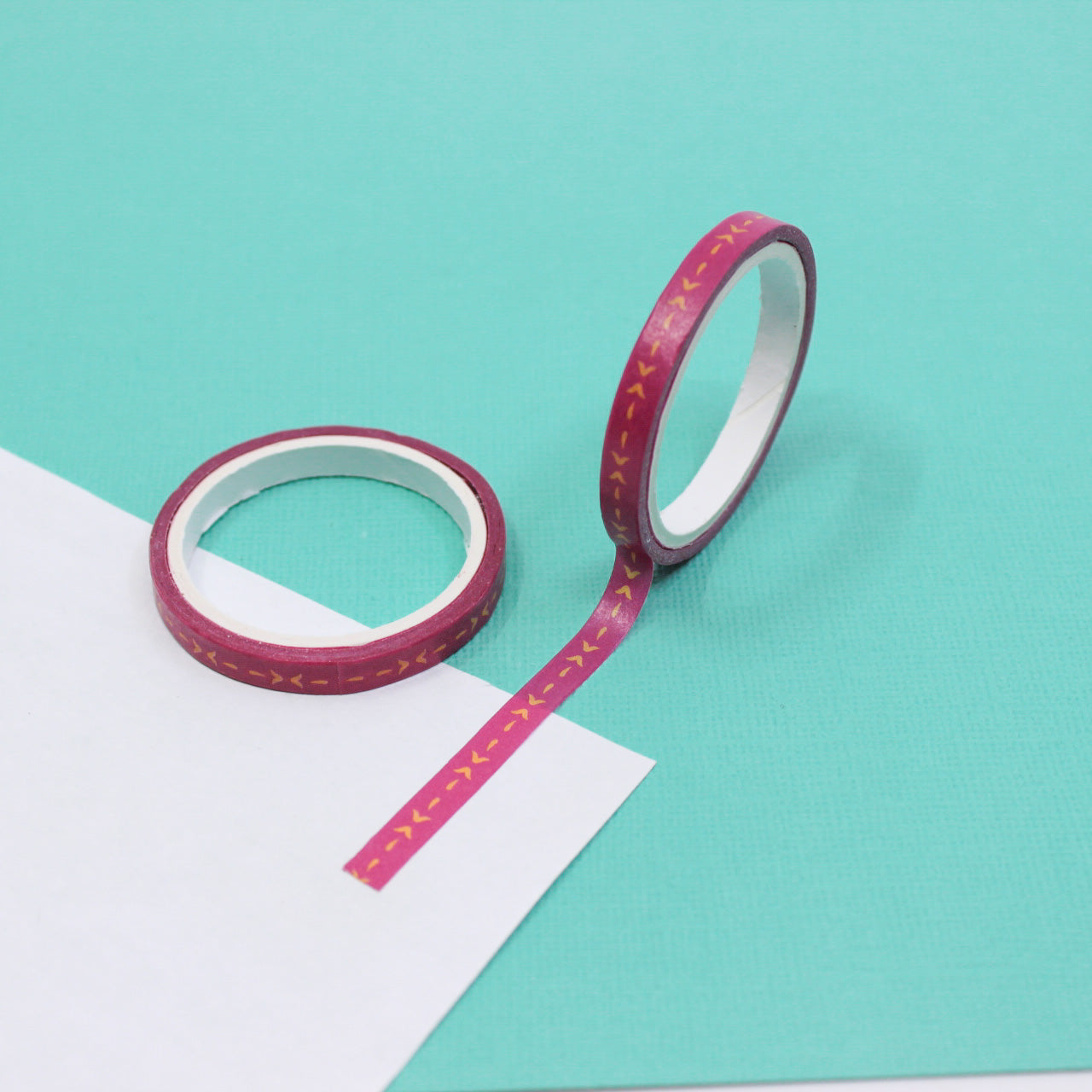 Enhance your crafts with our Pink Arrow Pattern Washi Tape, featuring a charming arrow design in a delightful shade of pink. Ideal for adding a playful and stylish touch to your projects. This tape is sold at BBB Supplies Craft Shop.